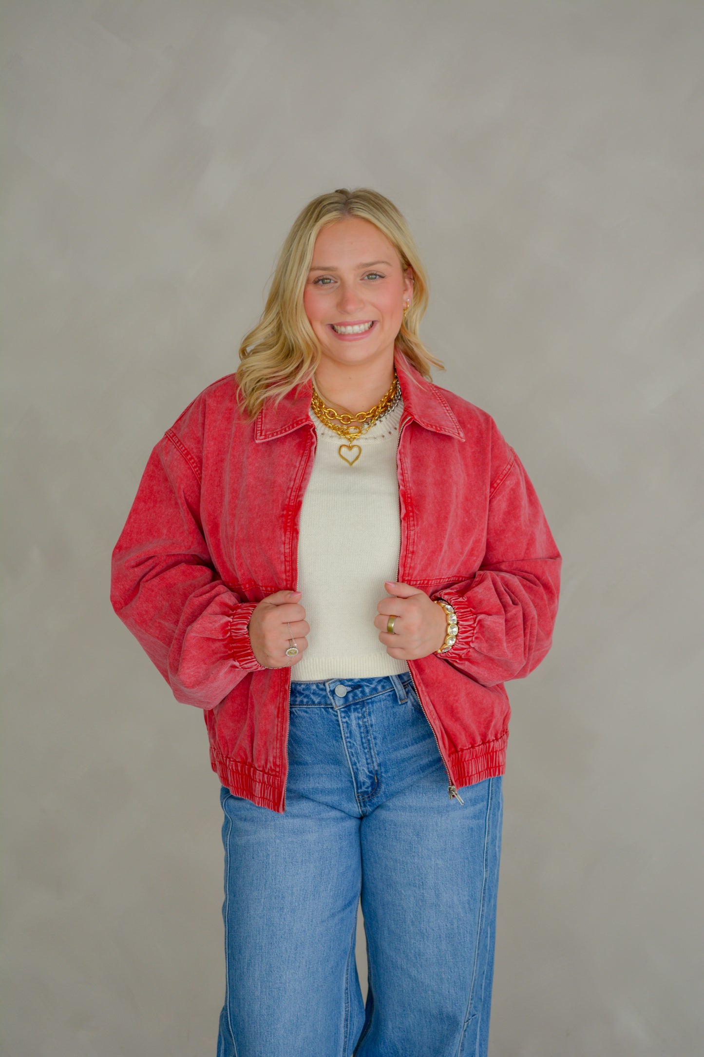 TCEC Dusty Trails denim jacket featuring classic blue denim fabric and button-up front on a hanger.