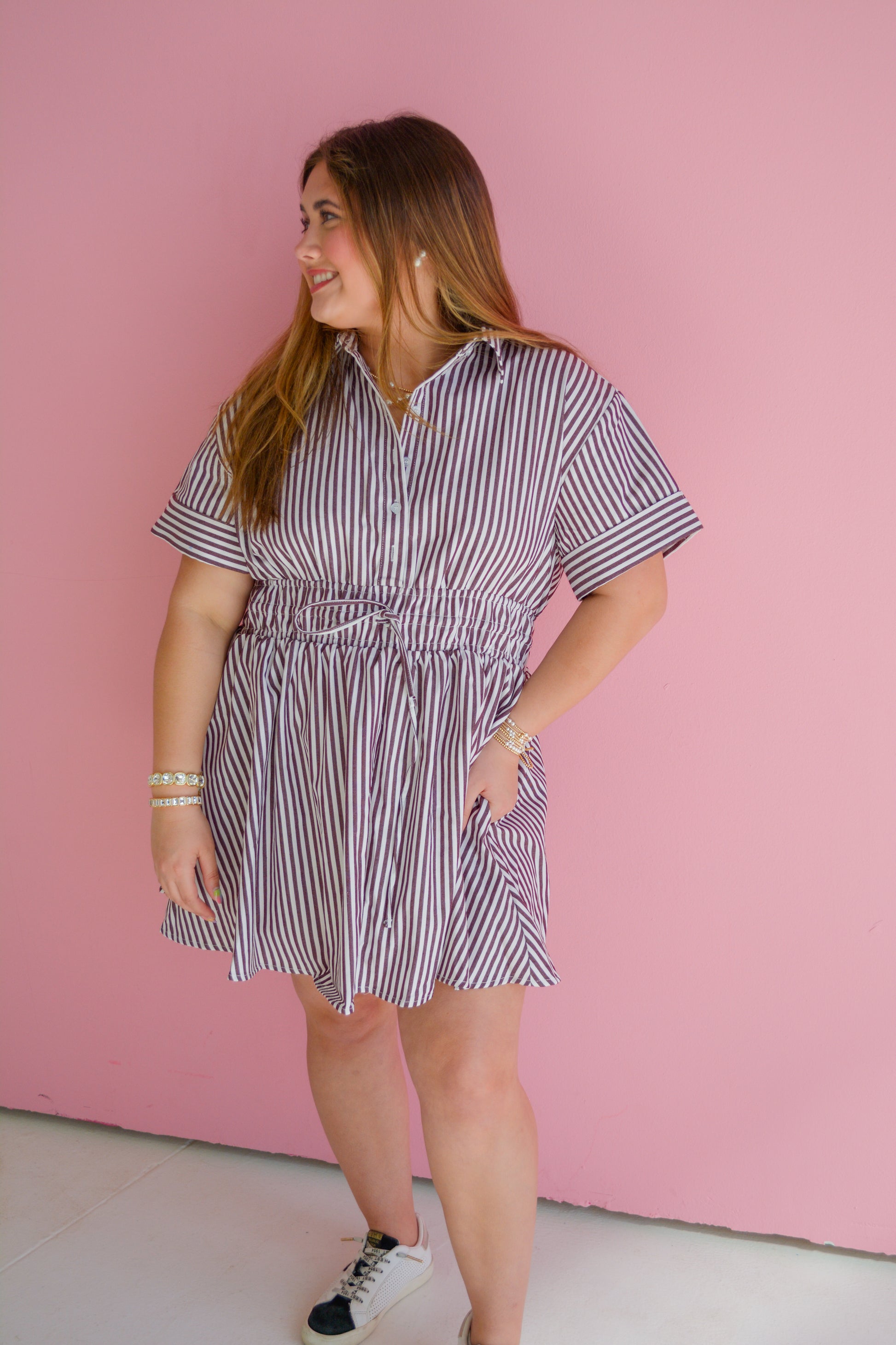 GLAM Latte Love Mini Dress displayed on a hanger, showcasing its soft fabric and stylish fit with neutral background.