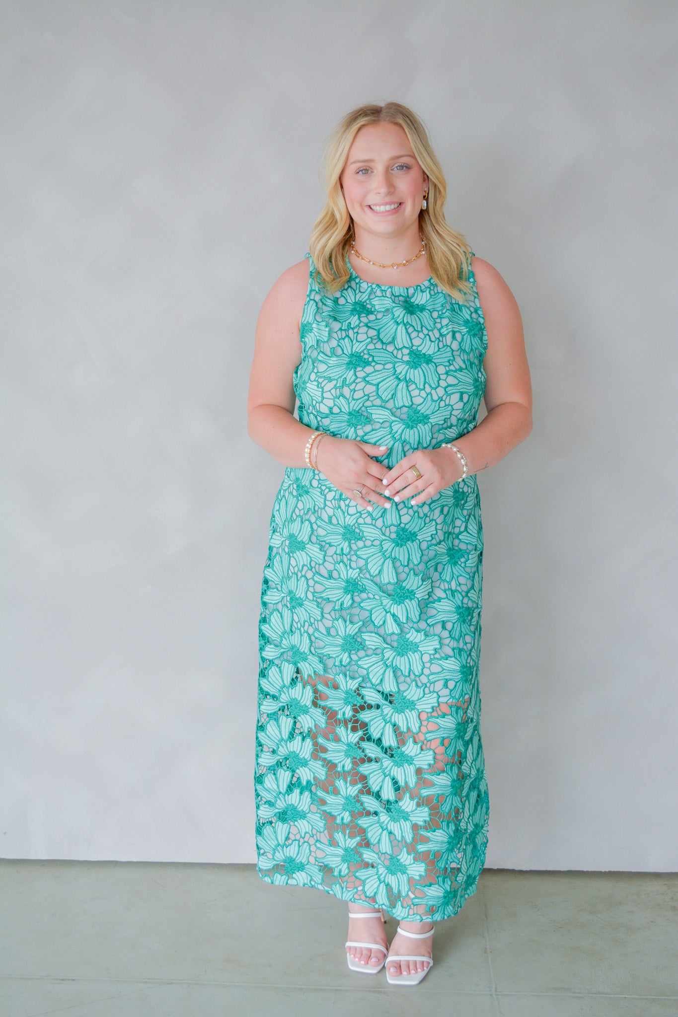 Emerald petal embroidered midi dress by English Factory, showcasing intricate floral embroidery and flowing fabric.