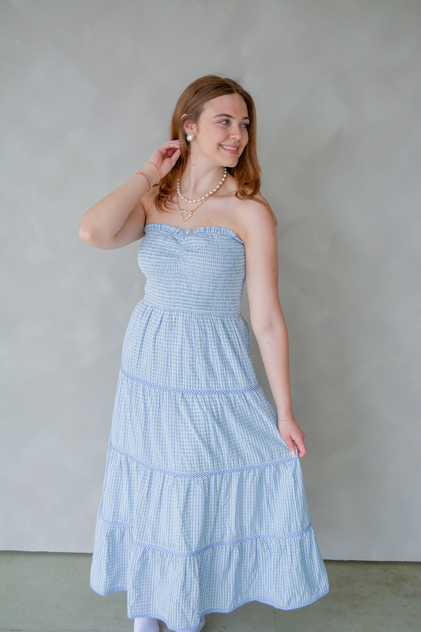 Baby Pink Soft Statement Midi Dress in baby blue, showcasing its flowing fabric and elegant design on a model.