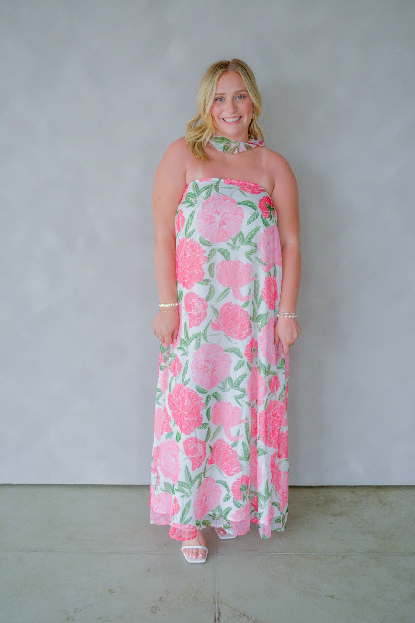 TCEC Blossom Breeze maxi dress with floral print, flowing fabric, and sleeveless design displayed in the image.