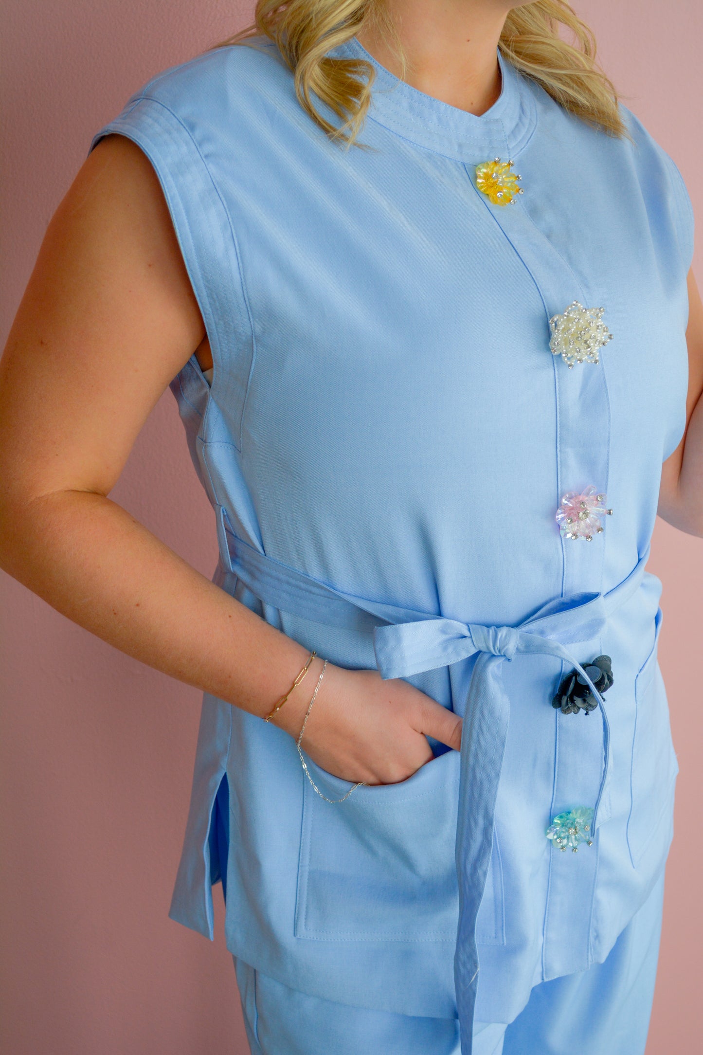 Entro Style Authority vest top displayed on a hanger, showcasing its casual sleeveless design and fabric texture.