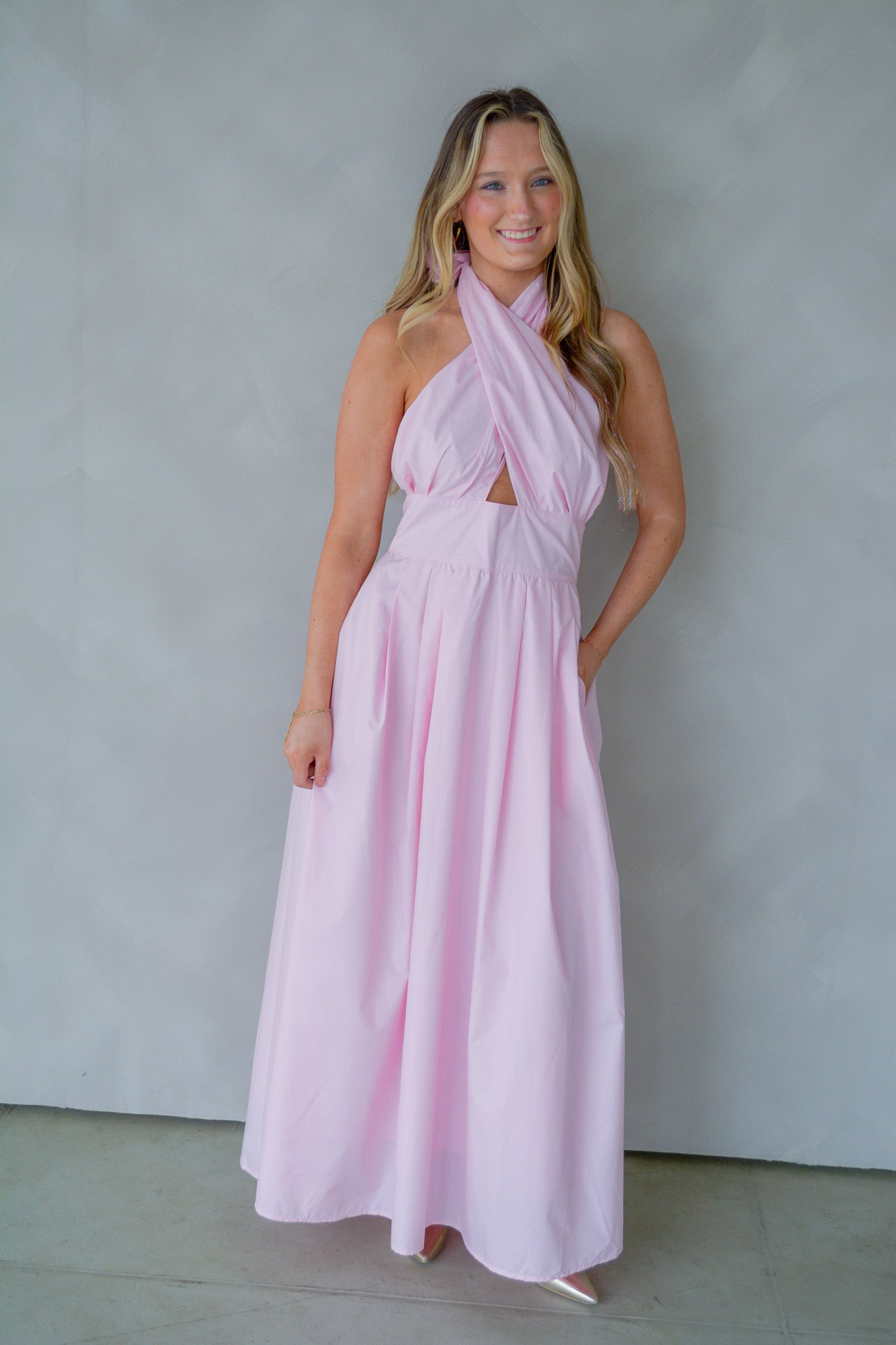 Baby Pink Everlasting Spring Maxi Dress shown on a hanger with floral pattern and flowing fabric.