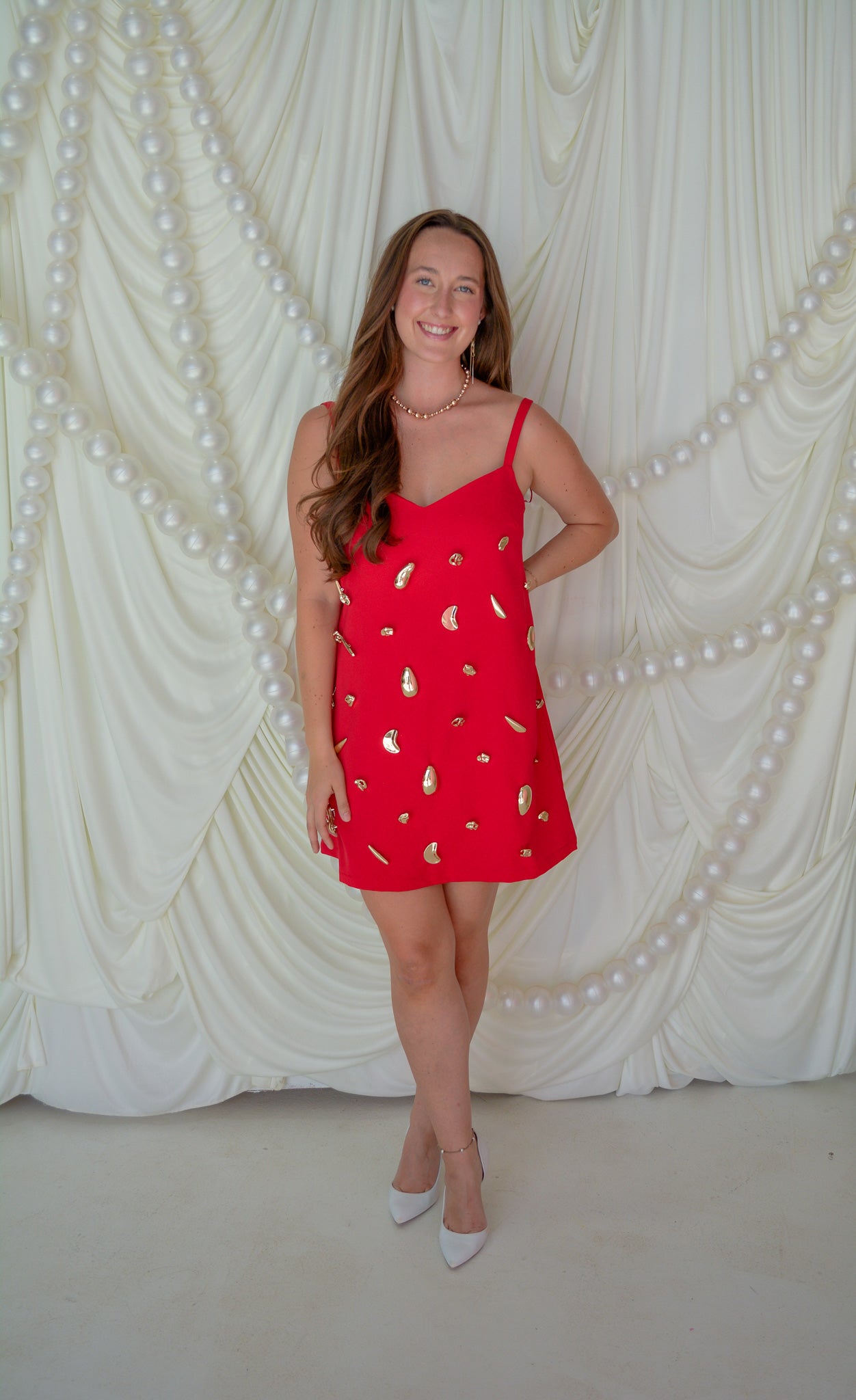 INA Modern Heirloom Dress displayed on a hanger, featuring elegant fabric and detailed design for a sophisticated look.
