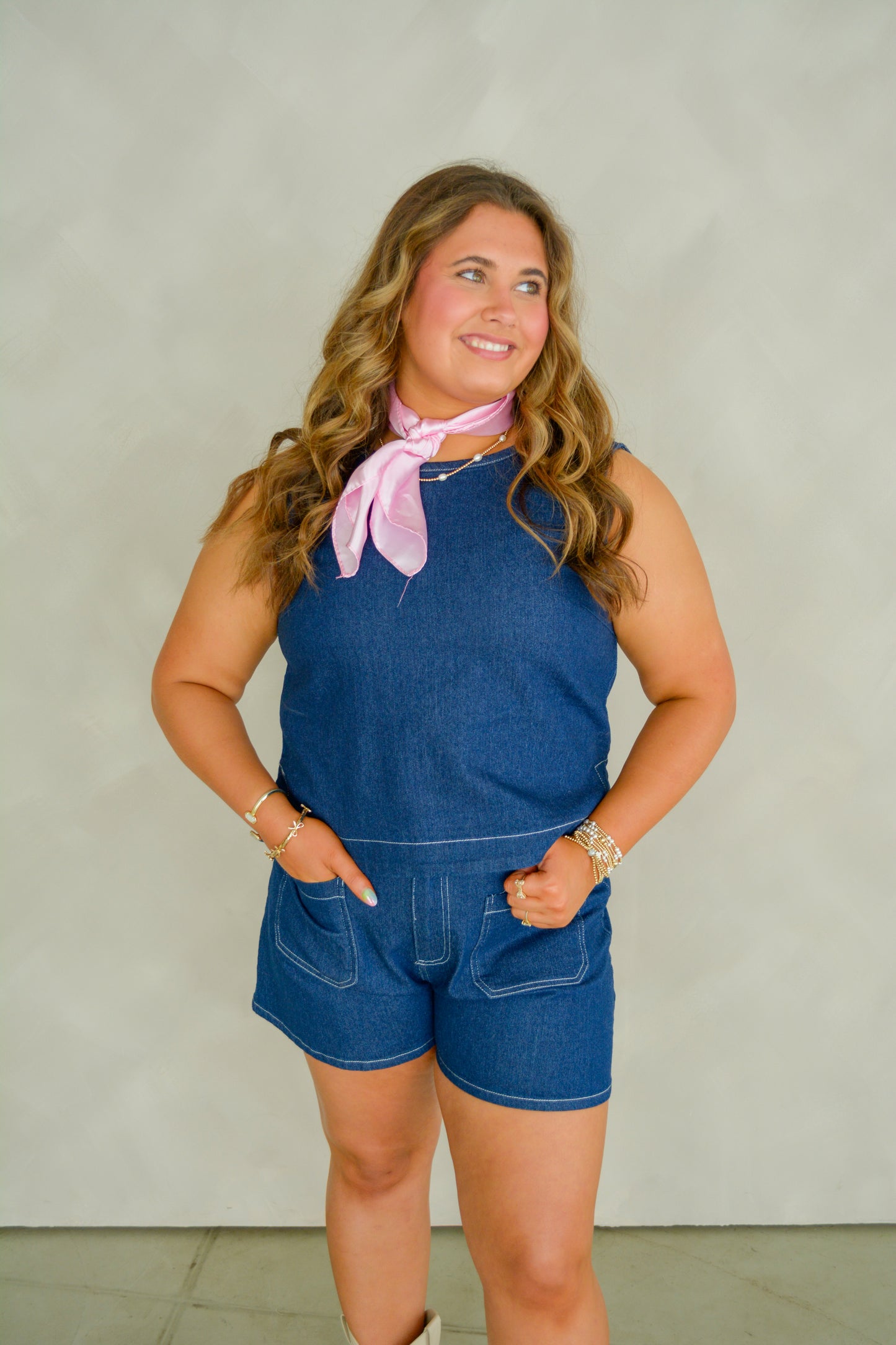 Baby Pink Western Wash Top displayed on a hanger, featuring a casual denim-inspired design with a wash finish.