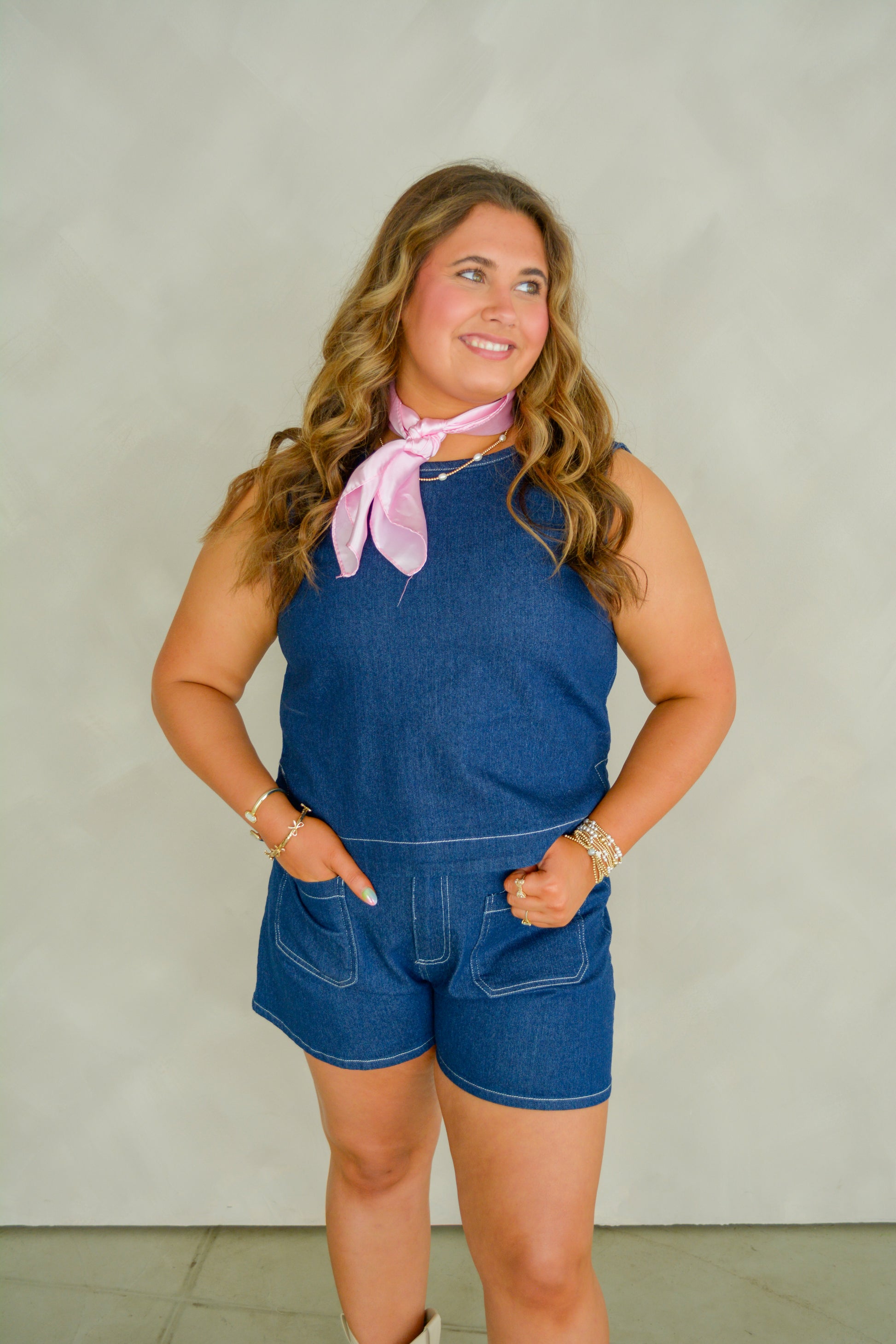 Baby Pink Western Wash Top displayed on a hanger, featuring a casual denim-inspired design with a wash finish.