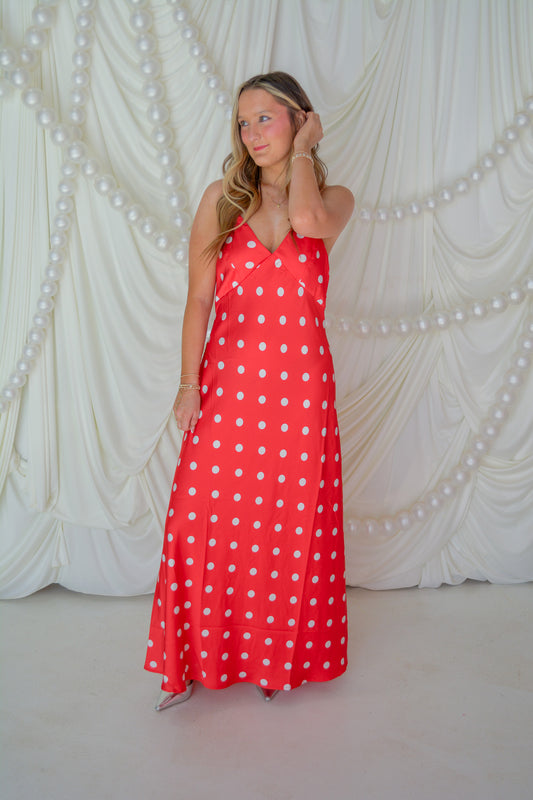 Eesome Dottie Delight Dress displayed on a hanger, featuring a stylish, playful polka dot pattern and a flattering fit.