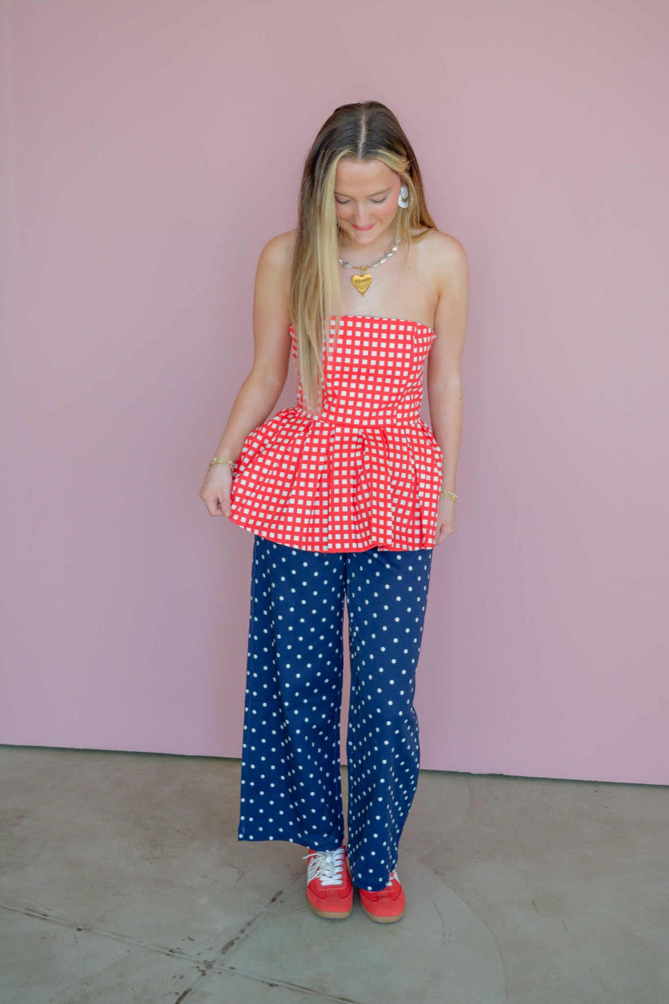 Entro Americana Darling strapless top shown on a hanger, featuring a lightweight fabric and a fitted, stylish design.
