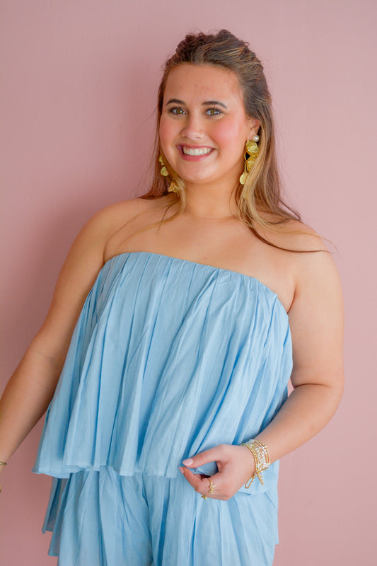 Mable Blended Sunsets top displayed on a hanger, featuring a colorful, abstract design with soft fabric and casual fit.