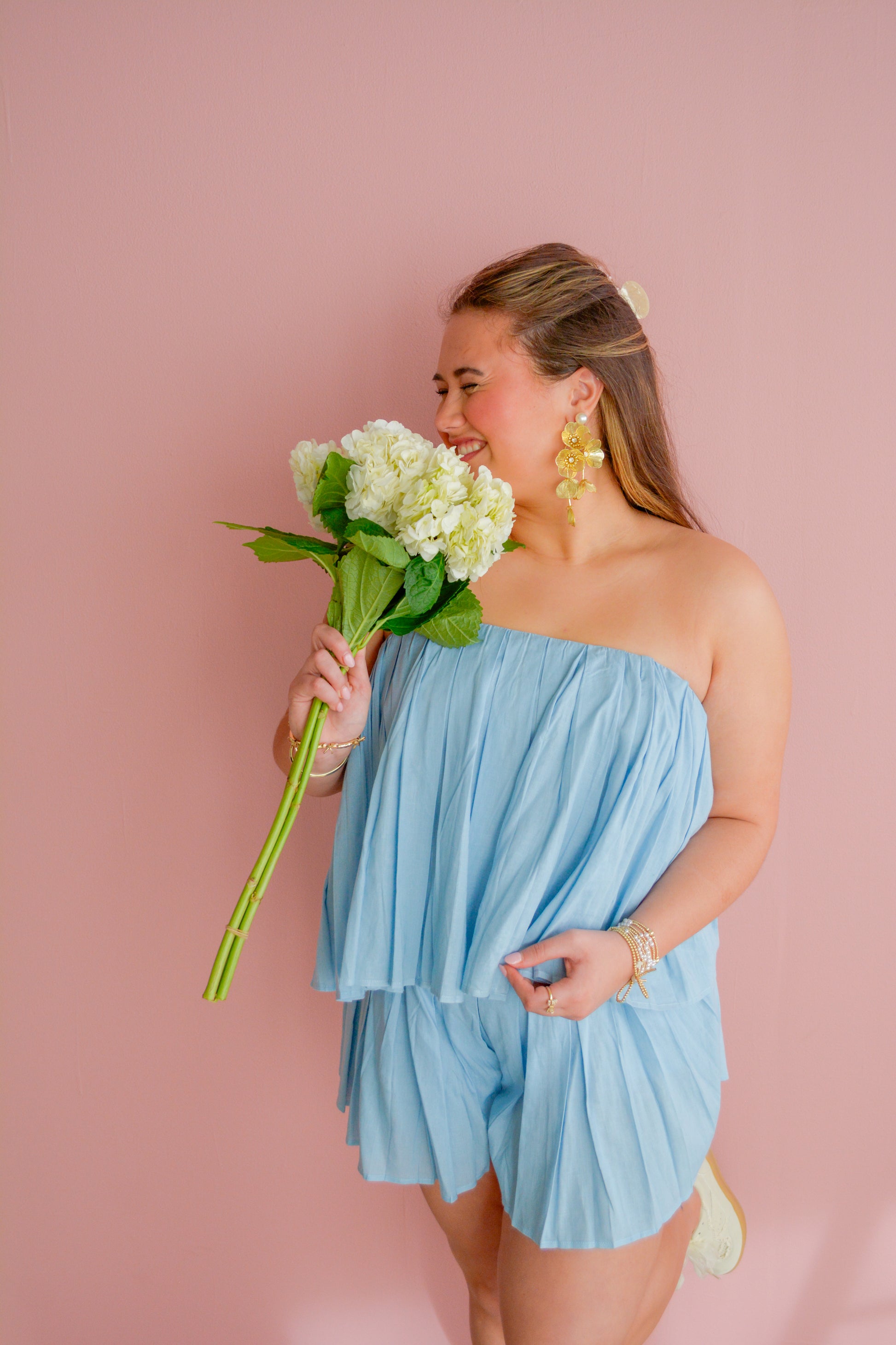 Mable Blended Sunsets Shorts featuring vibrant sunset-inspired patterns and comfortable fit, displayed on a hanger.