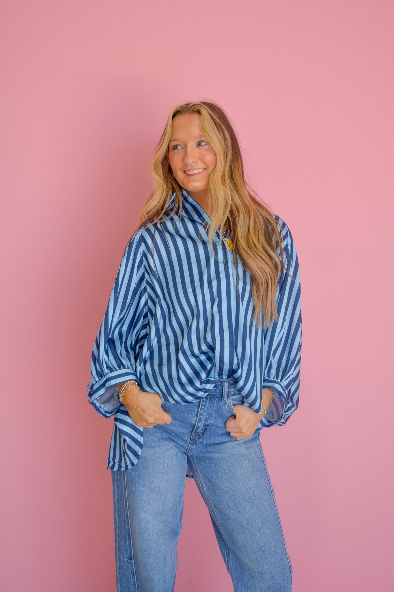 GLAM Harvest Mist blouse with flowy fabric and floral pattern, shown on a hanger against a neutral background.
