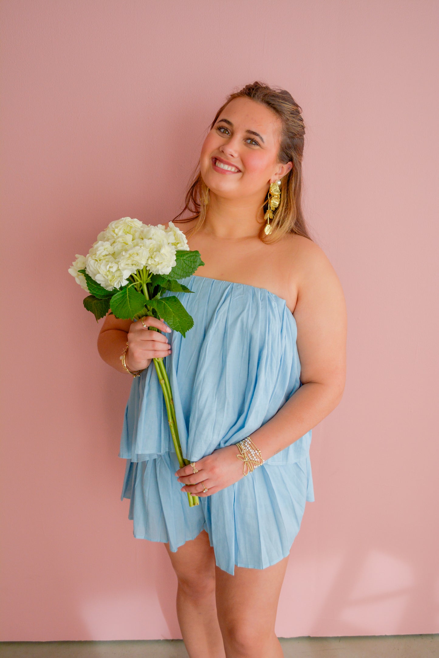 Mable Blended Sunsets top with vibrant, sunset-inspired colors and soft fabric, displayed on a hanger.