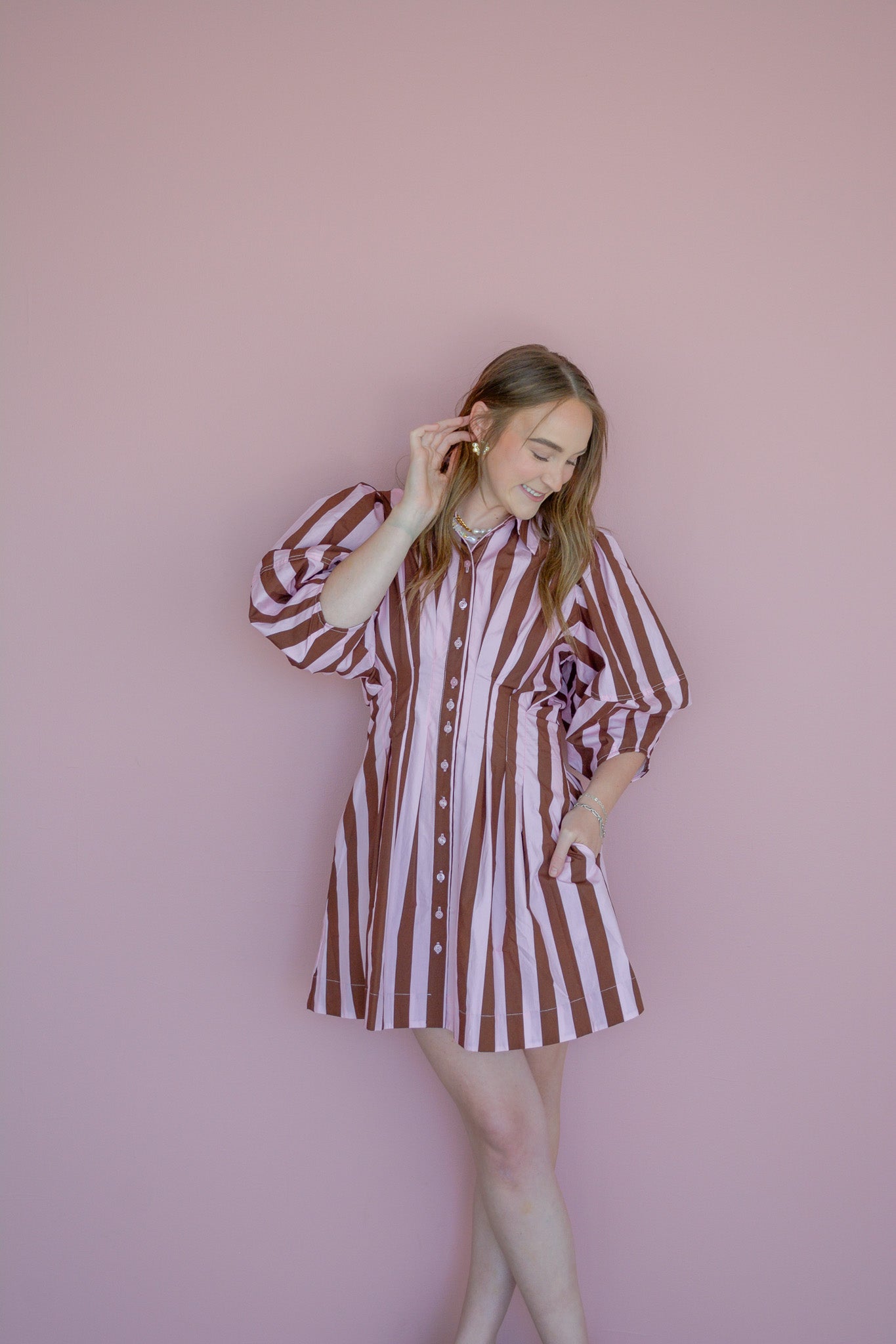 Strawberry mocha dress by Peach Love California featuring a stylish, fitted design with floral patterns and a flattering neckline.