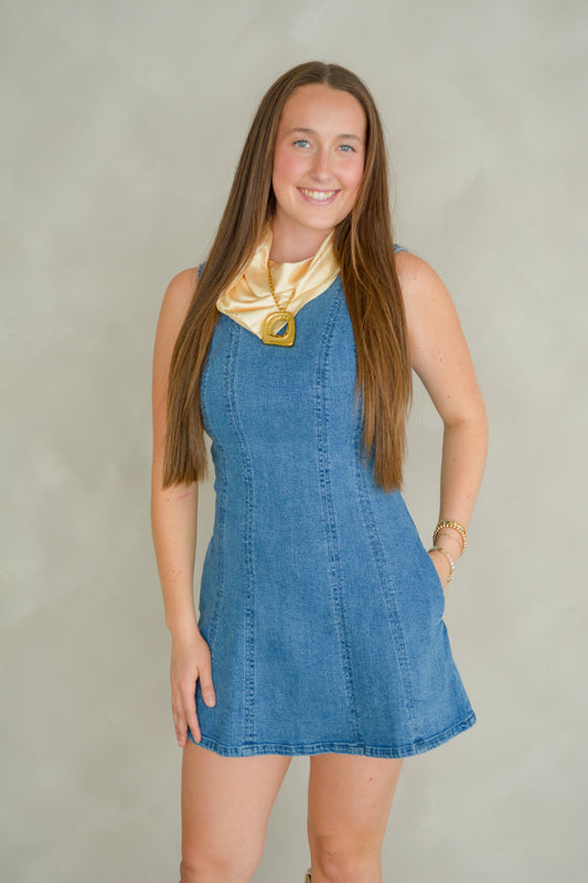 LE LIS Denim Darling Dress shown on a mannequin, featuring a casual denim fabric with a fitted silhouette and sleeveless design.