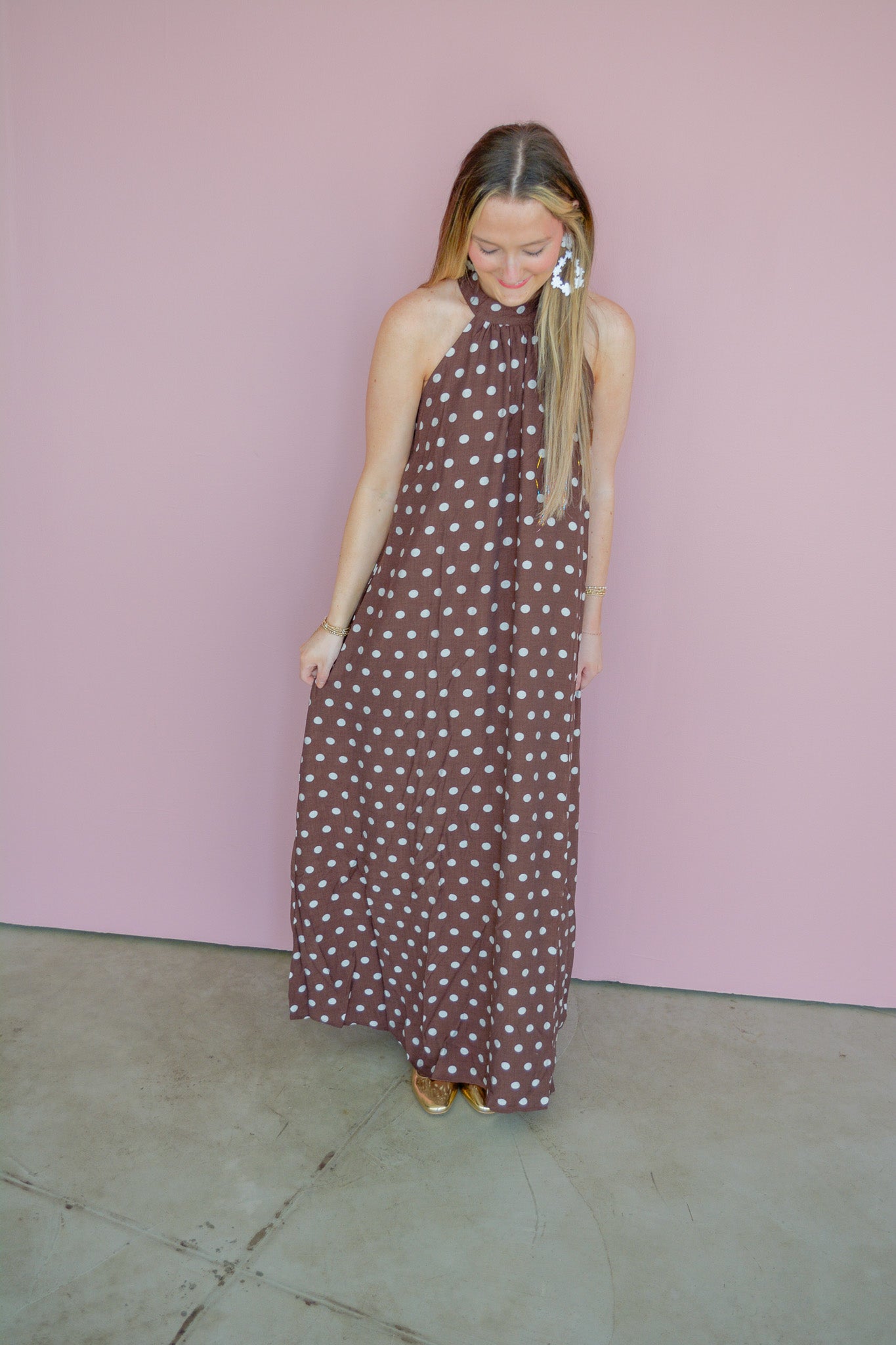 She & Sky Harvest Moon Maxi Dress with floral print, flowing fabric, and adjustable straps, displayed on a hanger.