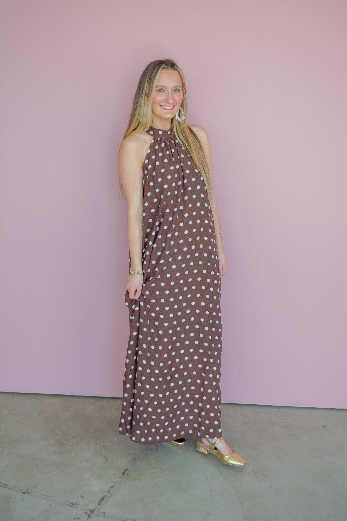 She & Sky Harvest Moon maxi dress featuring a flowing fabric and floral pattern, displayed on a hanger.