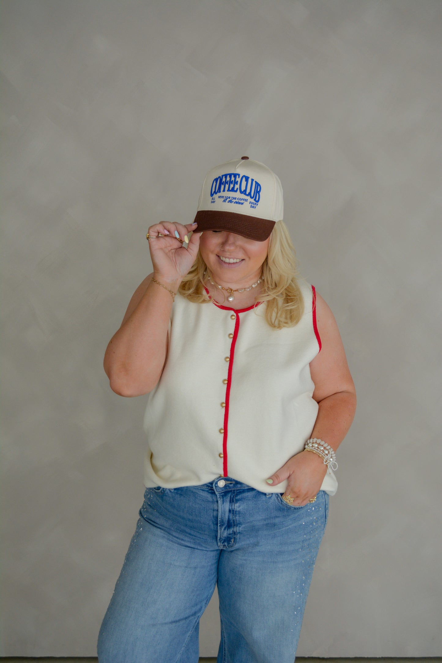 Curvy women's button vest top from Torque Fashion, featuring a stylish sleeveless design and classic button details.