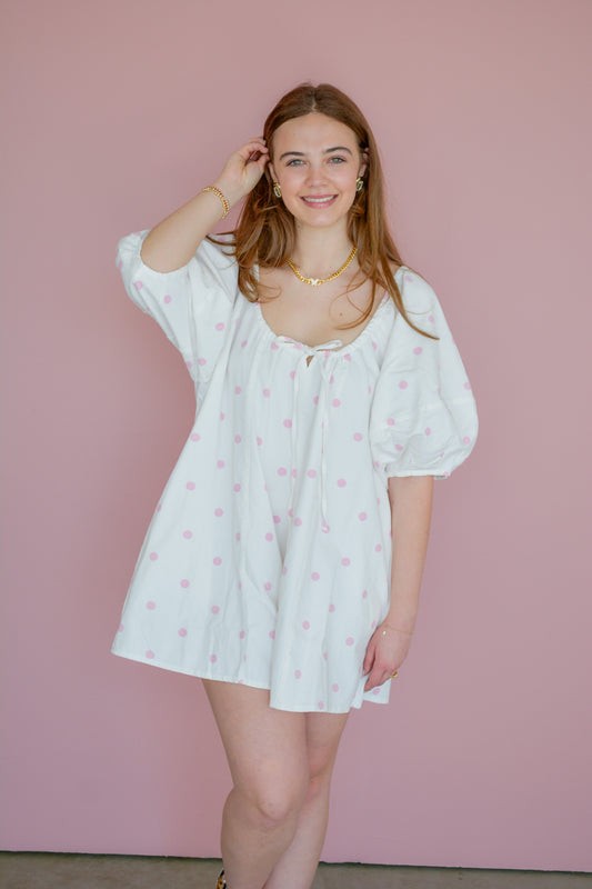 Peach Love California Posie Lane romper featuring floral print, sleeveless design, and relaxed fit, displayed on a hanger.