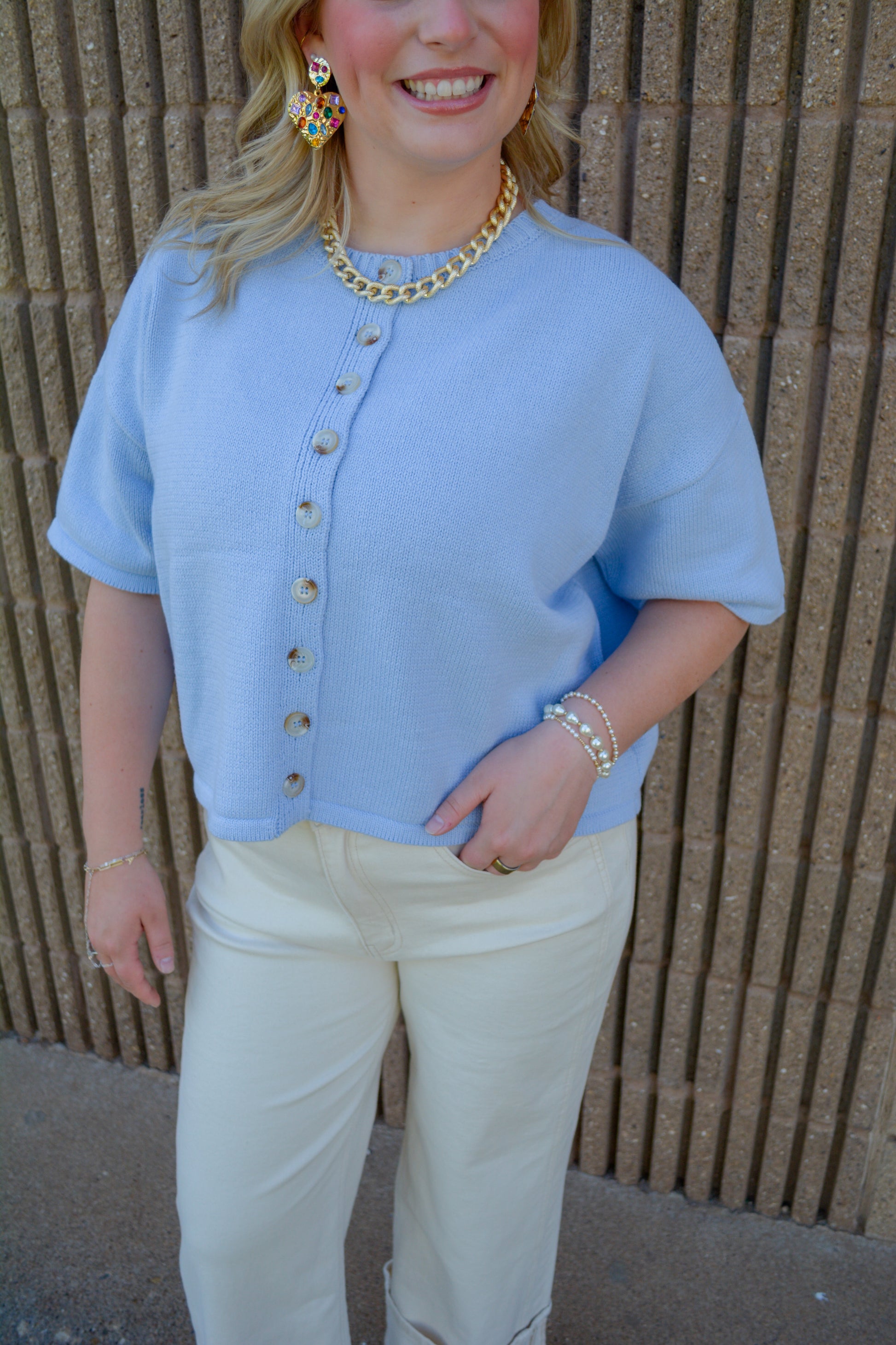 Wishlist Apparel Coastal Climate Top displayed on a hanger, featuring a lightweight, casual design in a neutral color.