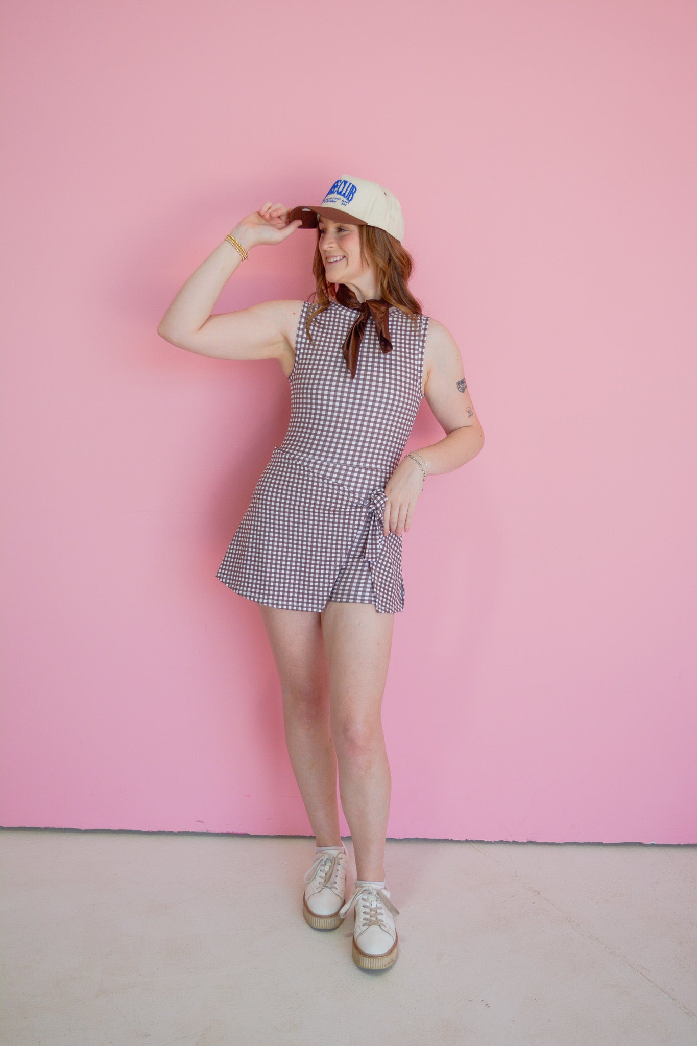 Sweet Espresso Active Dress by Kimberly displayed on a hanger, showcasing its stylish design and comfortable fit.
