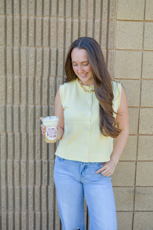 Wishlist Apparel Keegan Sweater Vest Top in Daisy Yellow, featuring a cozy knit fabric and sleeveless design.