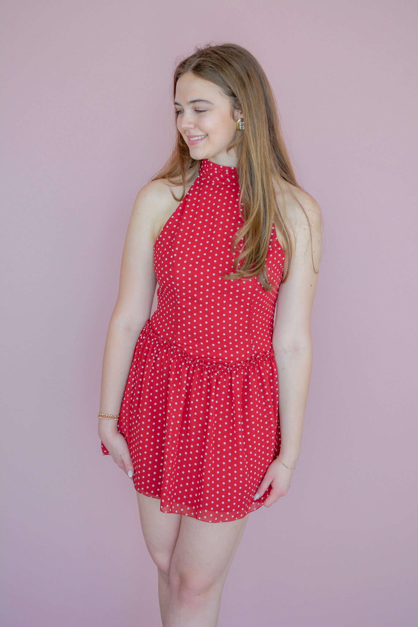 LE LIS Dotting on You Mini Dress displayed on a hanger, featuring a stylish design with dotted patterns and a fitted silhouette.