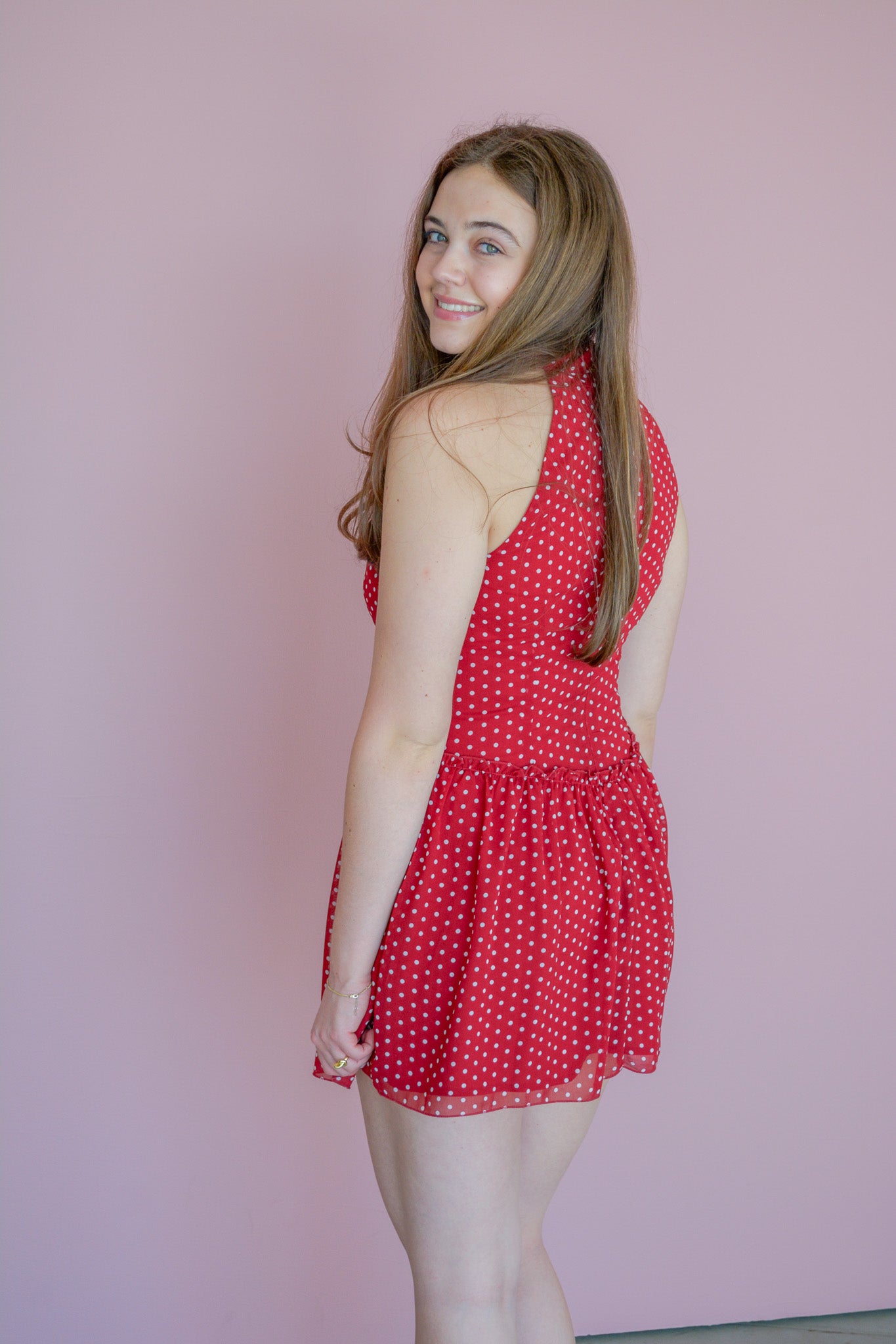 LE LIS Dotting on You Mini Dress displayed on a hanger, showcasing a stylish, patterned dress with a fitted silhouette.