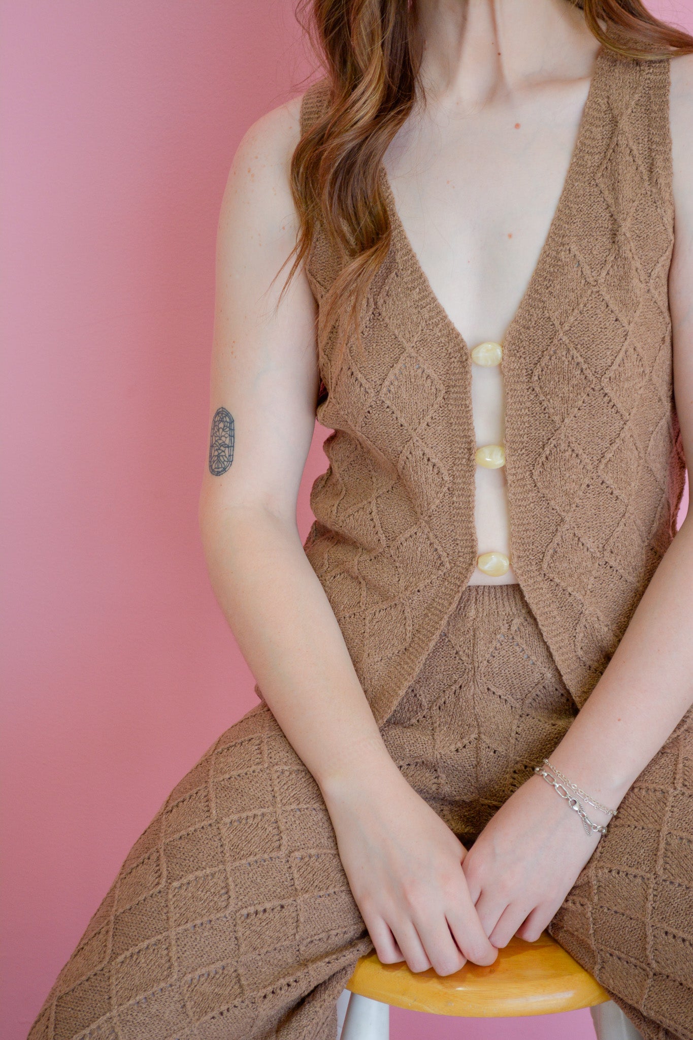 Surf Gypsy Cocoa Coast Knit Tank top in beige, featuring a relaxed fit and soft knit fabric, displayed on a hanger.