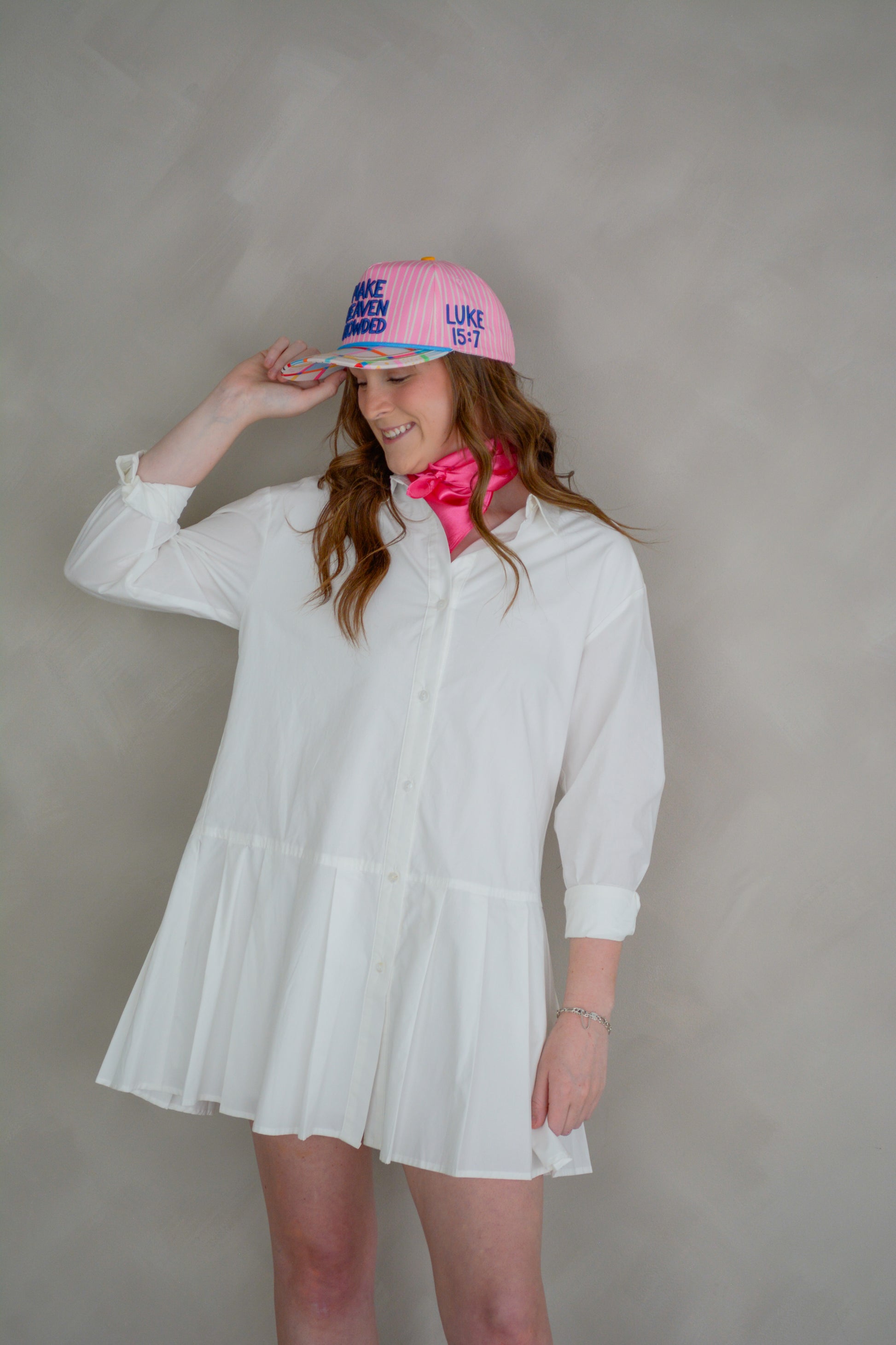 Able Poppy Pleated Shirtdress with long sleeves, button front, and waist tie, featuring a vibrant floral pattern.