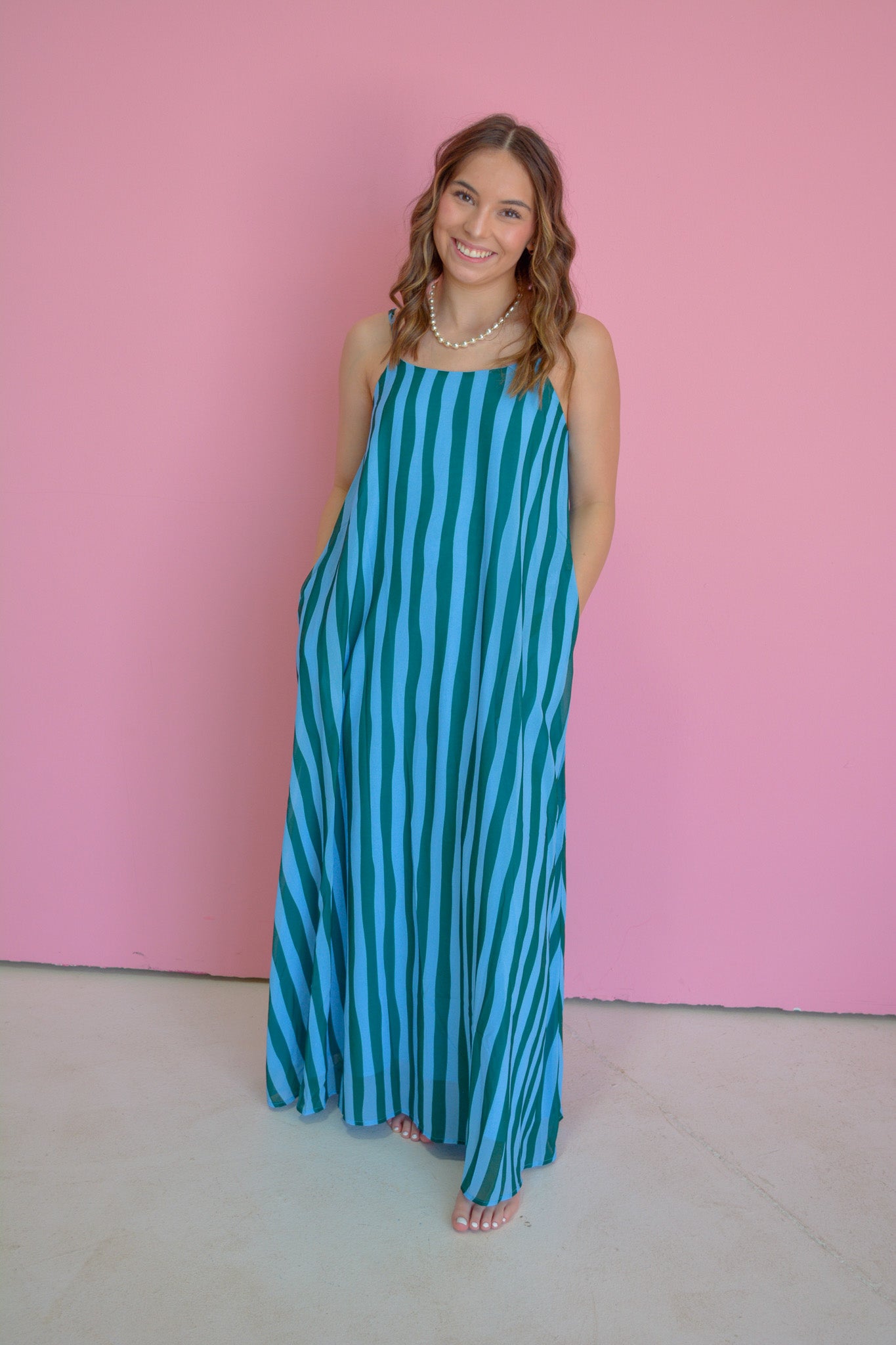 TCEC Island Escape Maxi Dress featuring tropical print, flowy fabric, and sleeveless design, perfect for summer outings.