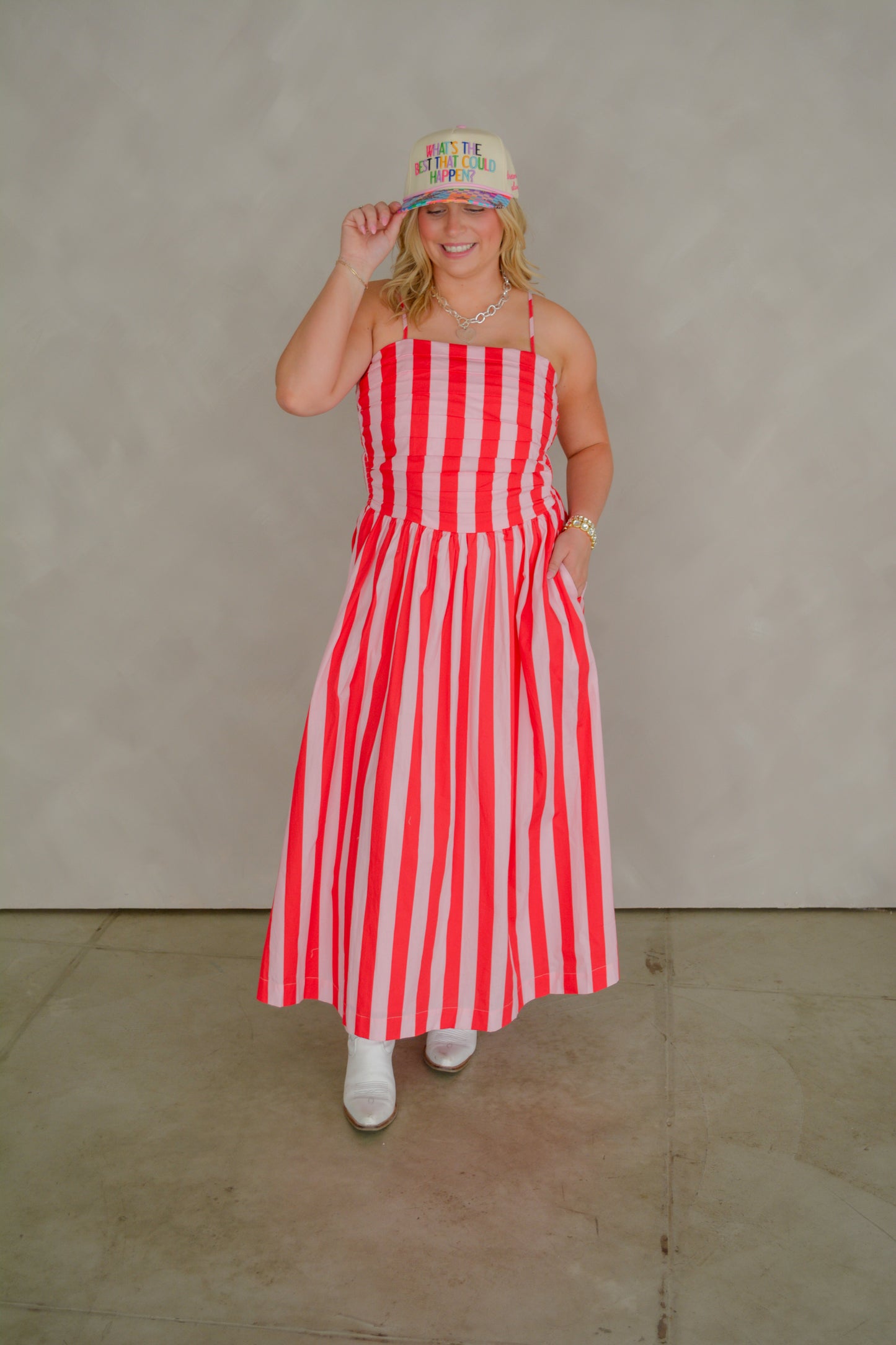 TCEC The Brunch & Go Dress displayed on a hanger, featuring a stylish, casual design in light fabric with floral accents.