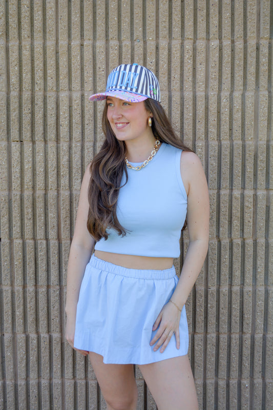 Wishlist Apparel The Amanda Set, stylish two-piece outfit with a crop top and matching skirt, shown on a model.