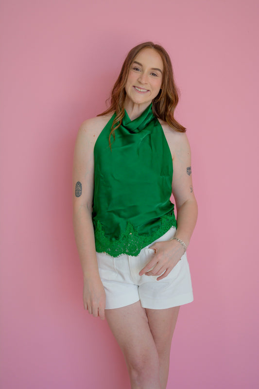 GLAM Silk Haven Emerald Top displayed on a mannequin, showcasing its silky fabric and stylish design.