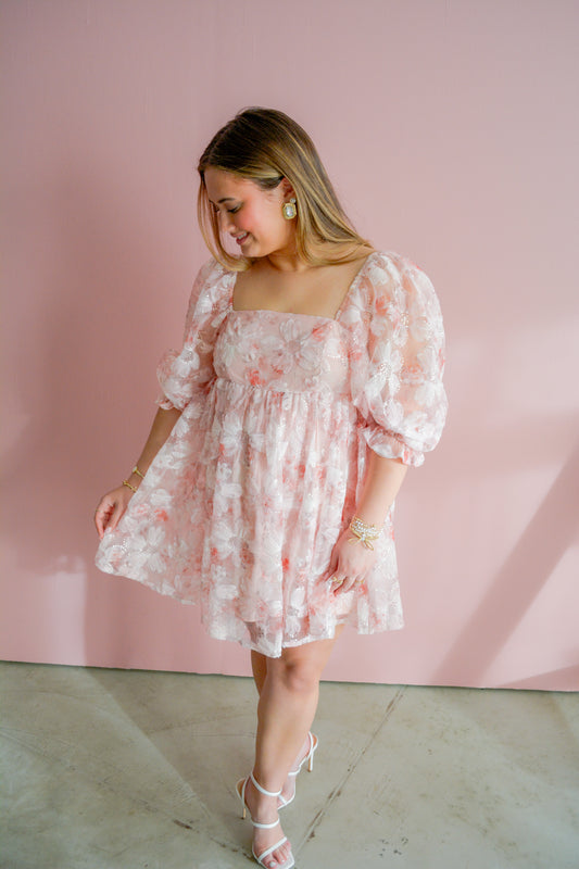 Entro Spring Romance Dress displayed on a hanger with floral pattern and flowy fabric, perfect for springtime wear.