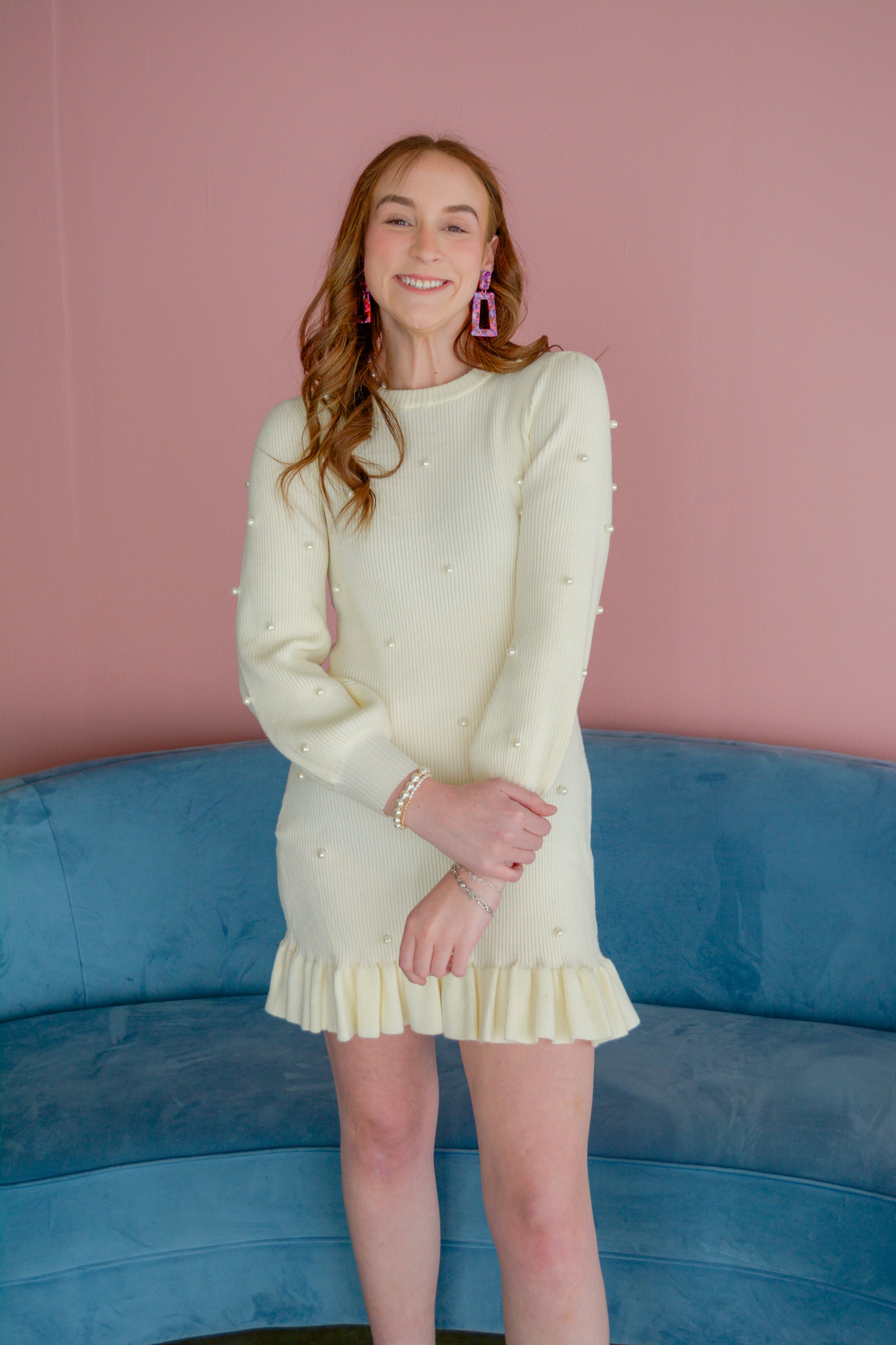 Able Ophelia Pearl Dress in soft fabric with intricate pearl embellishments and a flowing silhouette, displayed on a hanger.