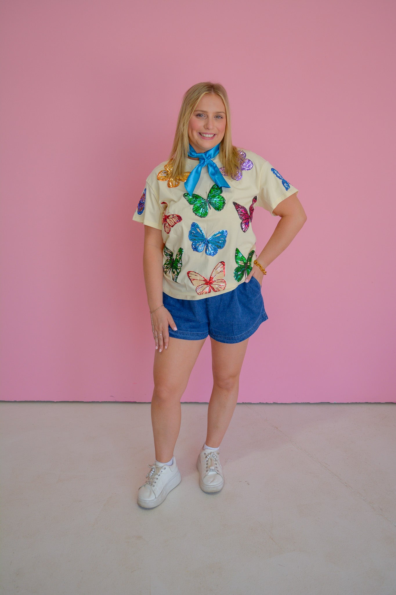 RJM Glitz Butterfly Bliss Sequin Tee featuring colorful butterfly sequins on a stylish short-sleeve shirt.