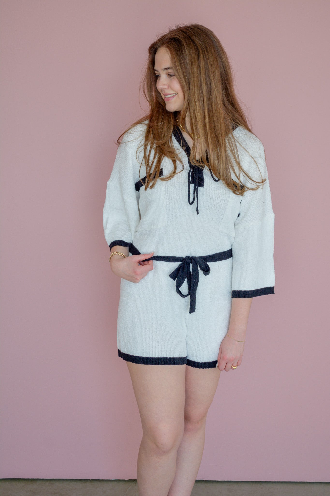 Hyfve The Getaway romper displayed on a hanger, featuring a sleeveless design with a relaxed fit and stylish print.