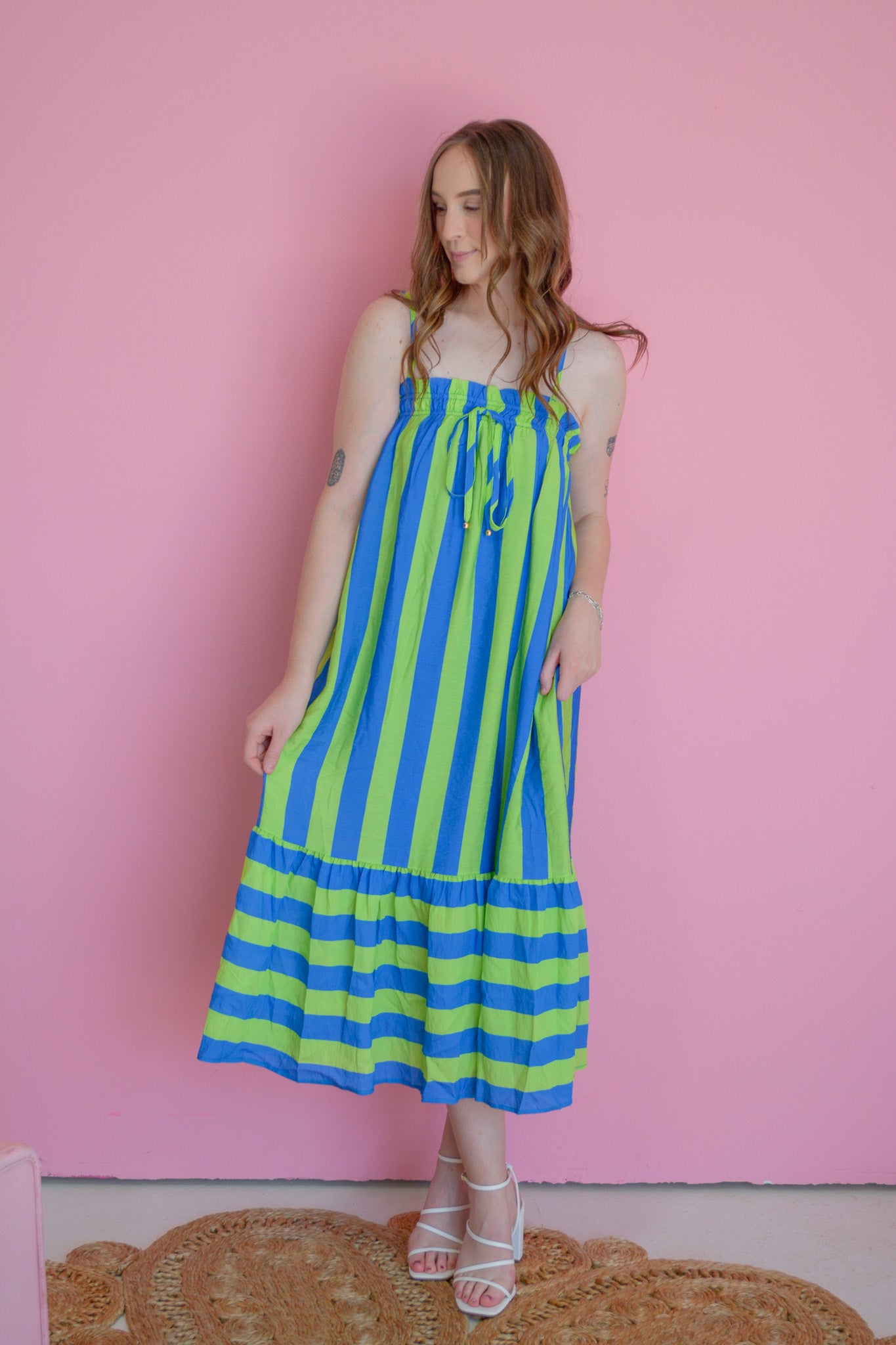 Entro Electric Wave maxi dress featuring vibrant, flowing fabric and a stylish design displayed on a mannequin.