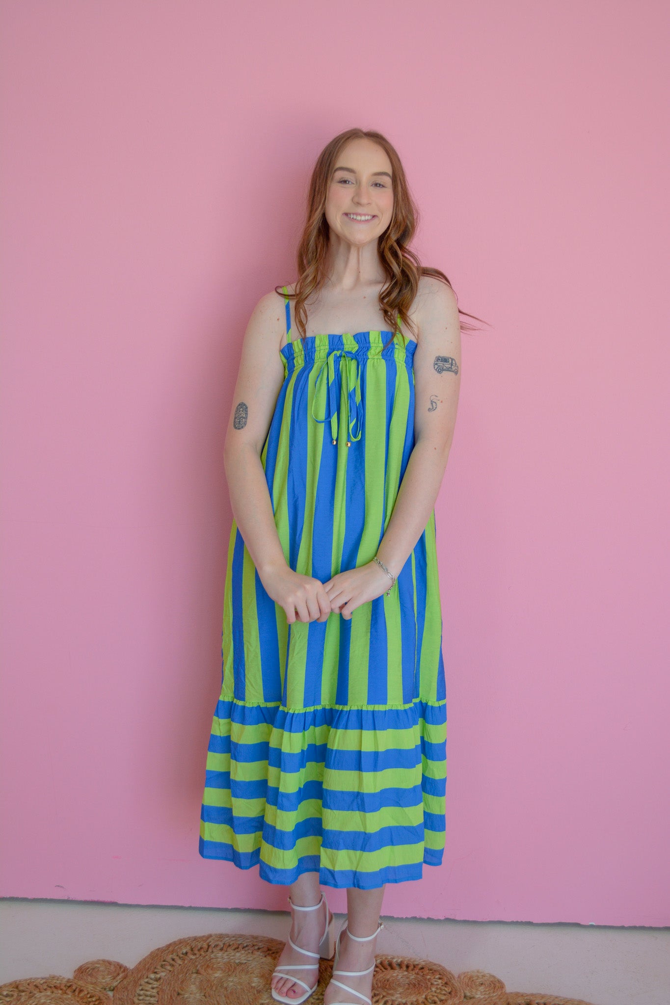 Entro electric wave maxi dress displayed on a hanger, featuring flowing fabric and vibrant wave pattern, perfect for summer wear.