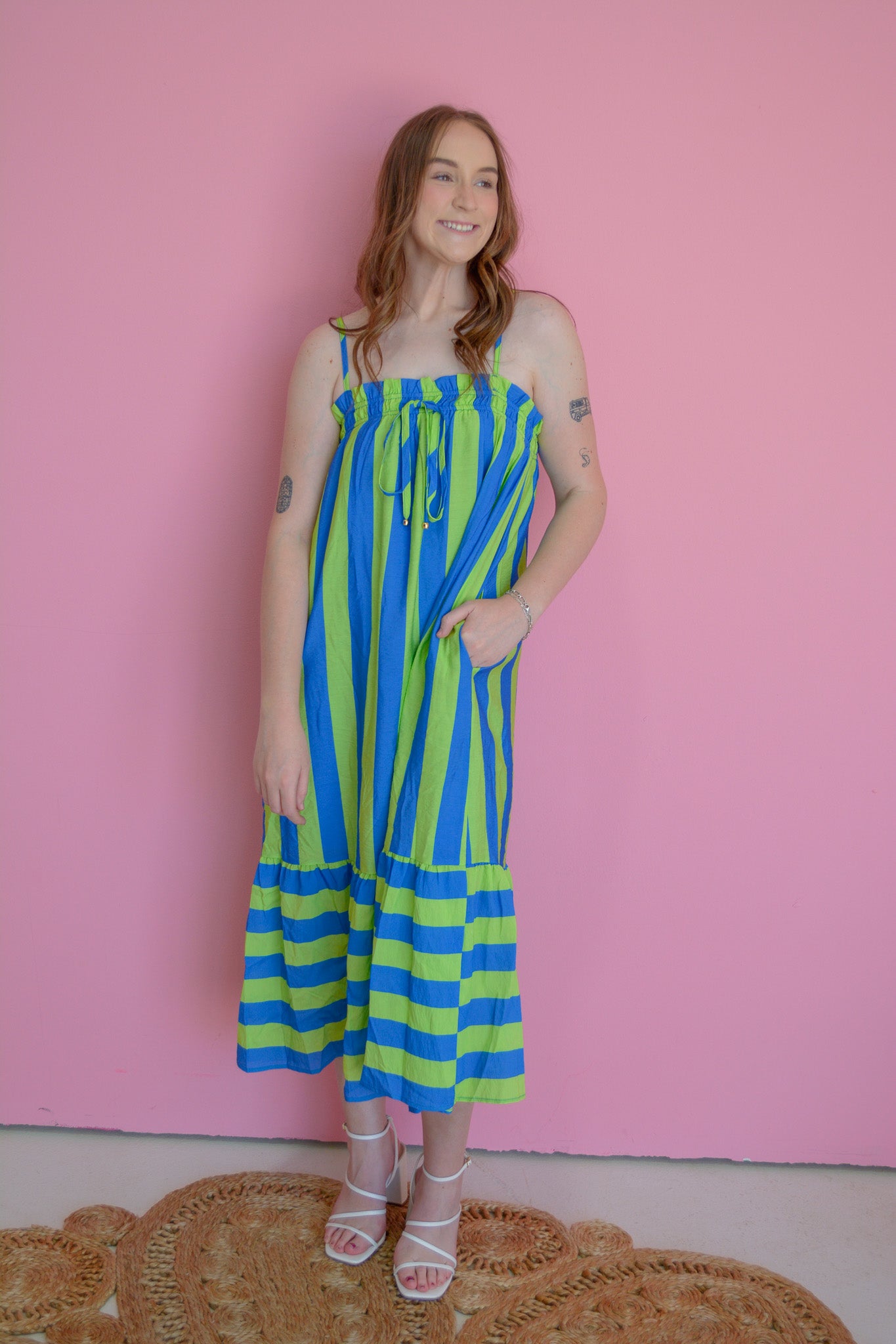 Entro Electric Wave Maxi Dress in flowing fabric with vibrant wave pattern, sleeveless design, and high neckline.