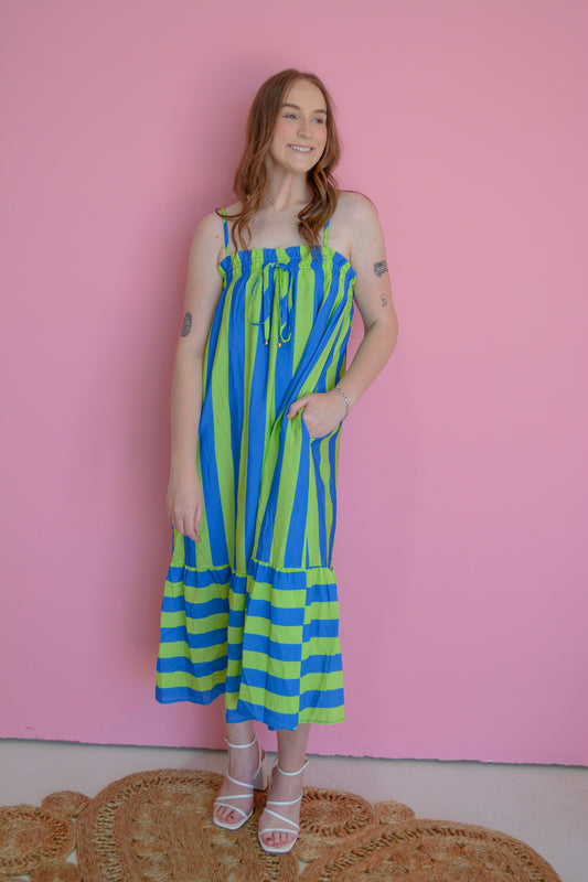 Entro Electric Wave Maxi Dress in flowing fabric with vibrant wave pattern, sleeveless design, and high neckline.
