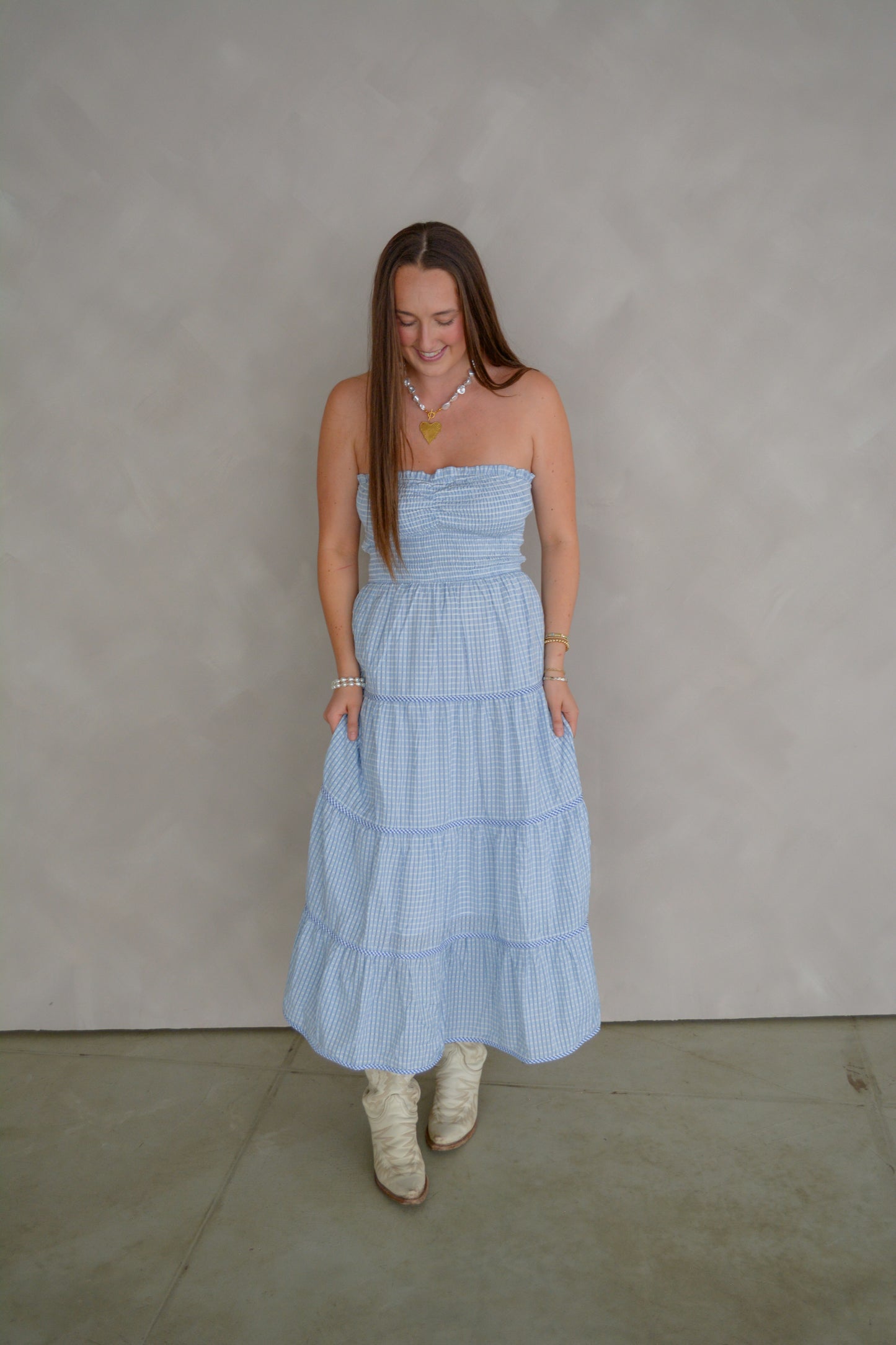 Baby Pink Soft Statement Midi Dress in baby blue, lightweight fabric with a fitted waist and flowing skirt, stylish and elegant.