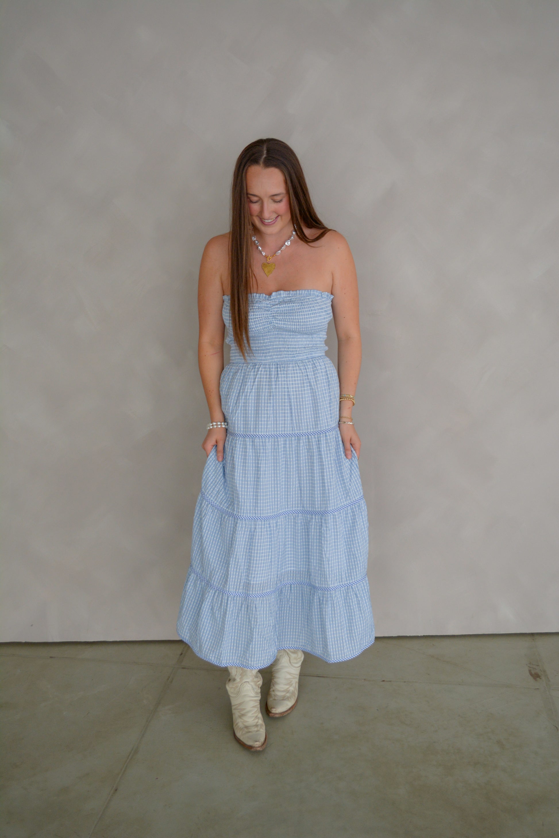 Baby Pink Soft Statement Midi Dress in baby blue, lightweight fabric with a fitted waist and flowing skirt, stylish and elegant.