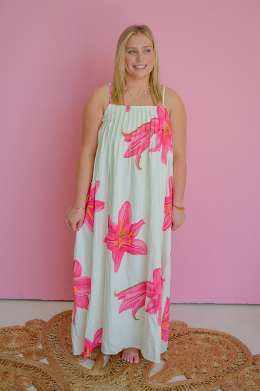 TCEC Tropical Petals Dress featuring vibrant floral print, lightweight fabric, sleeveless design, and a flowing silhouette.