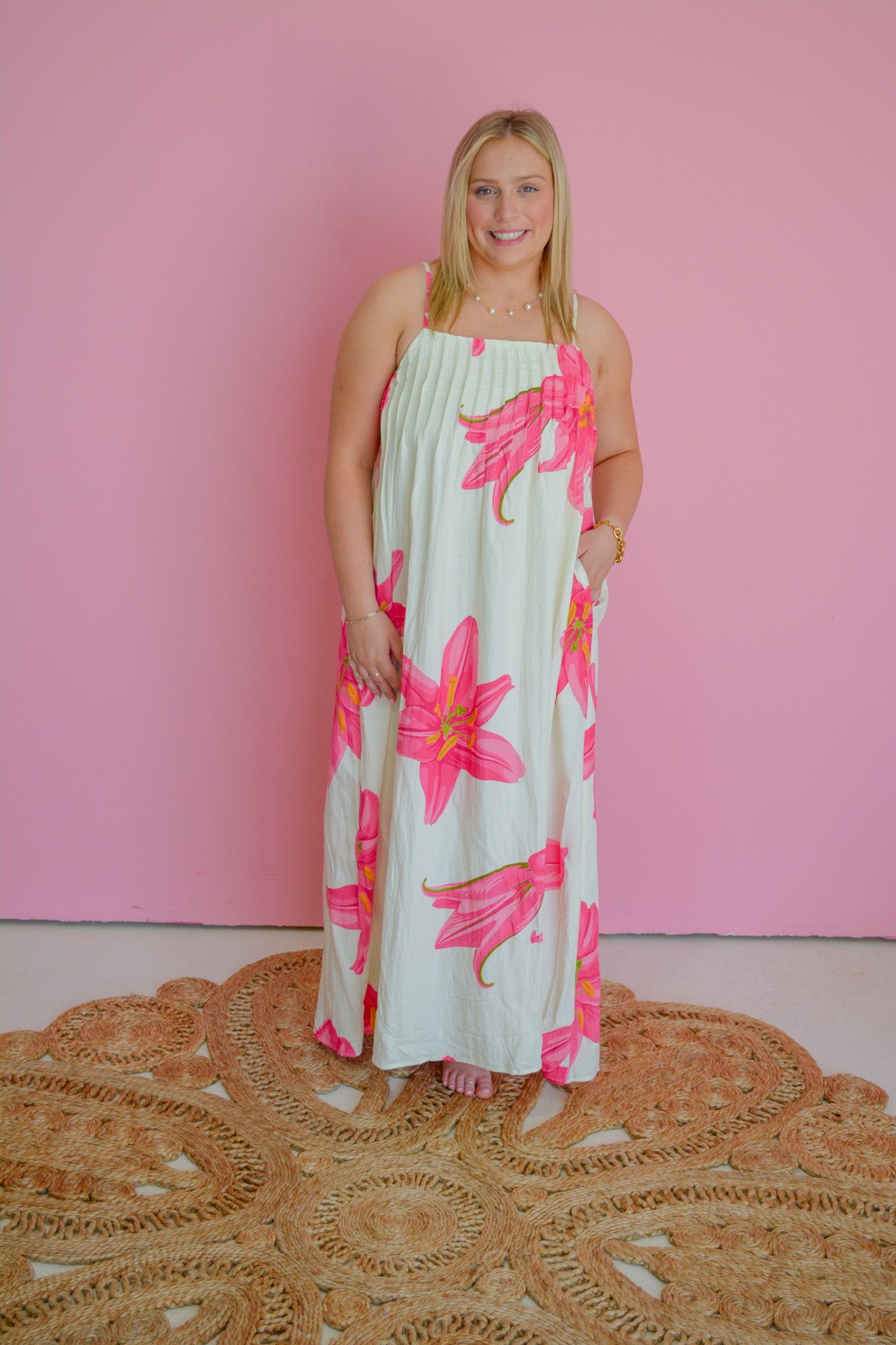 TCEC Tropical Petals Dress featuring vibrant floral print and lightweight fabric, displayed on a mannequin.