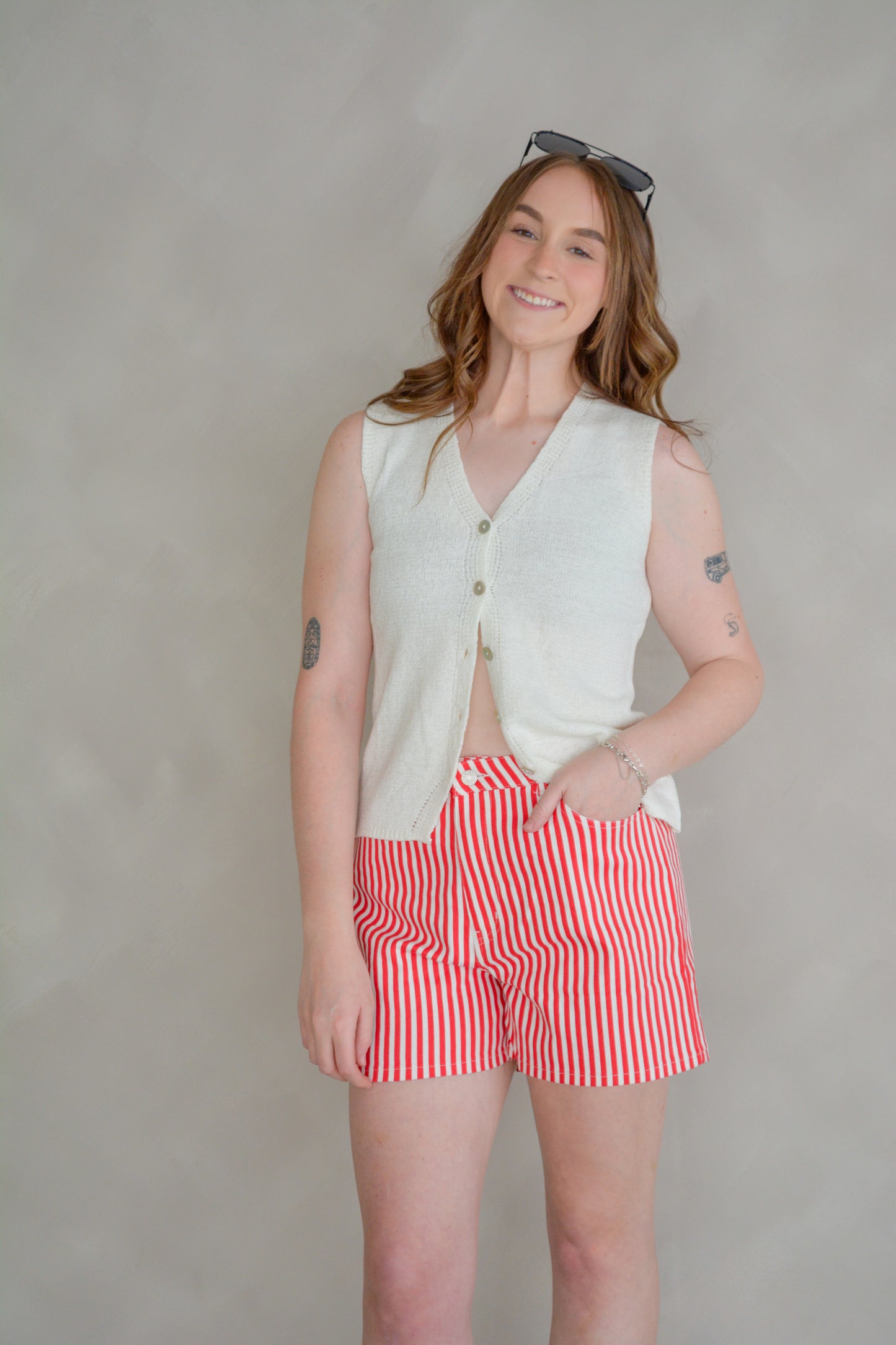 Off-White The It Girl Sweater Vest by She+Sky, featuring a cozy knit design with stylish she+sky branding on the front.