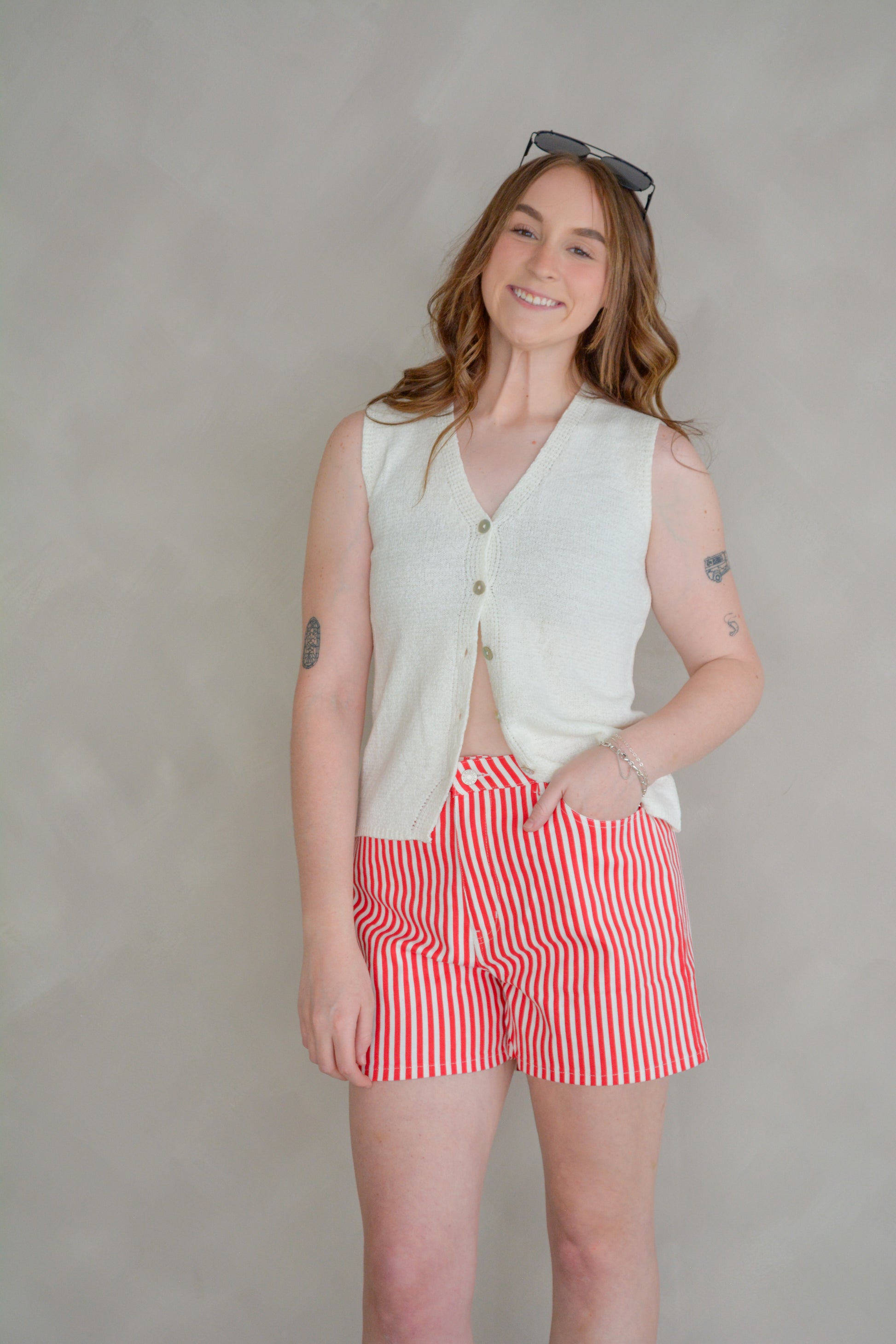 Off-White The It Girl Sweater Vest by She+Sky, featuring a cozy knit design with stylish she+sky branding on the front.