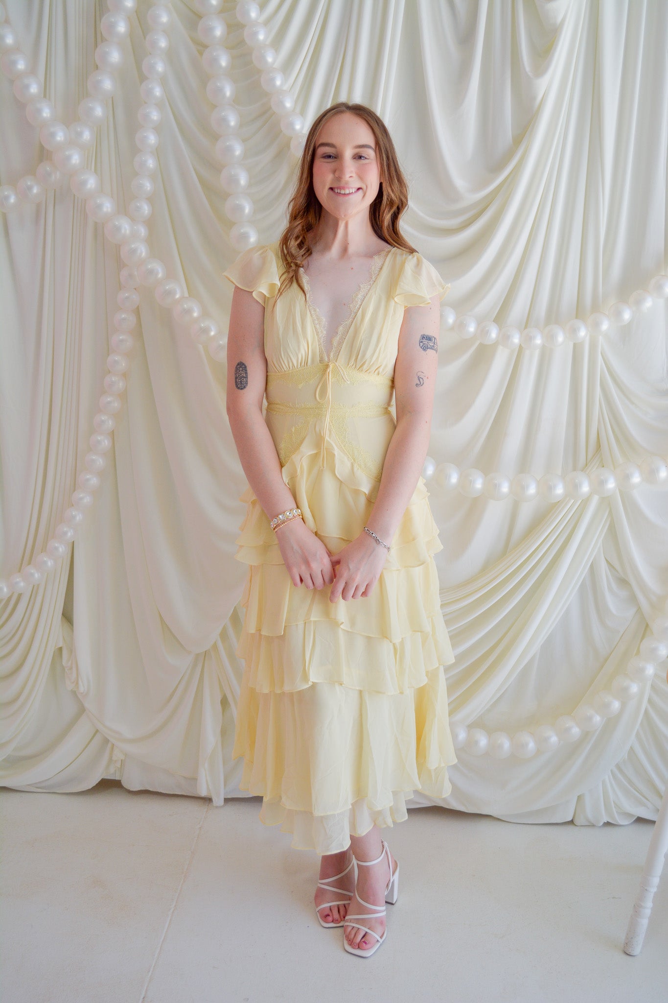 Storia Sunshine Bliss midi dress featuring a flowy, floral design and lightweight fabric, perfect for warm weather.