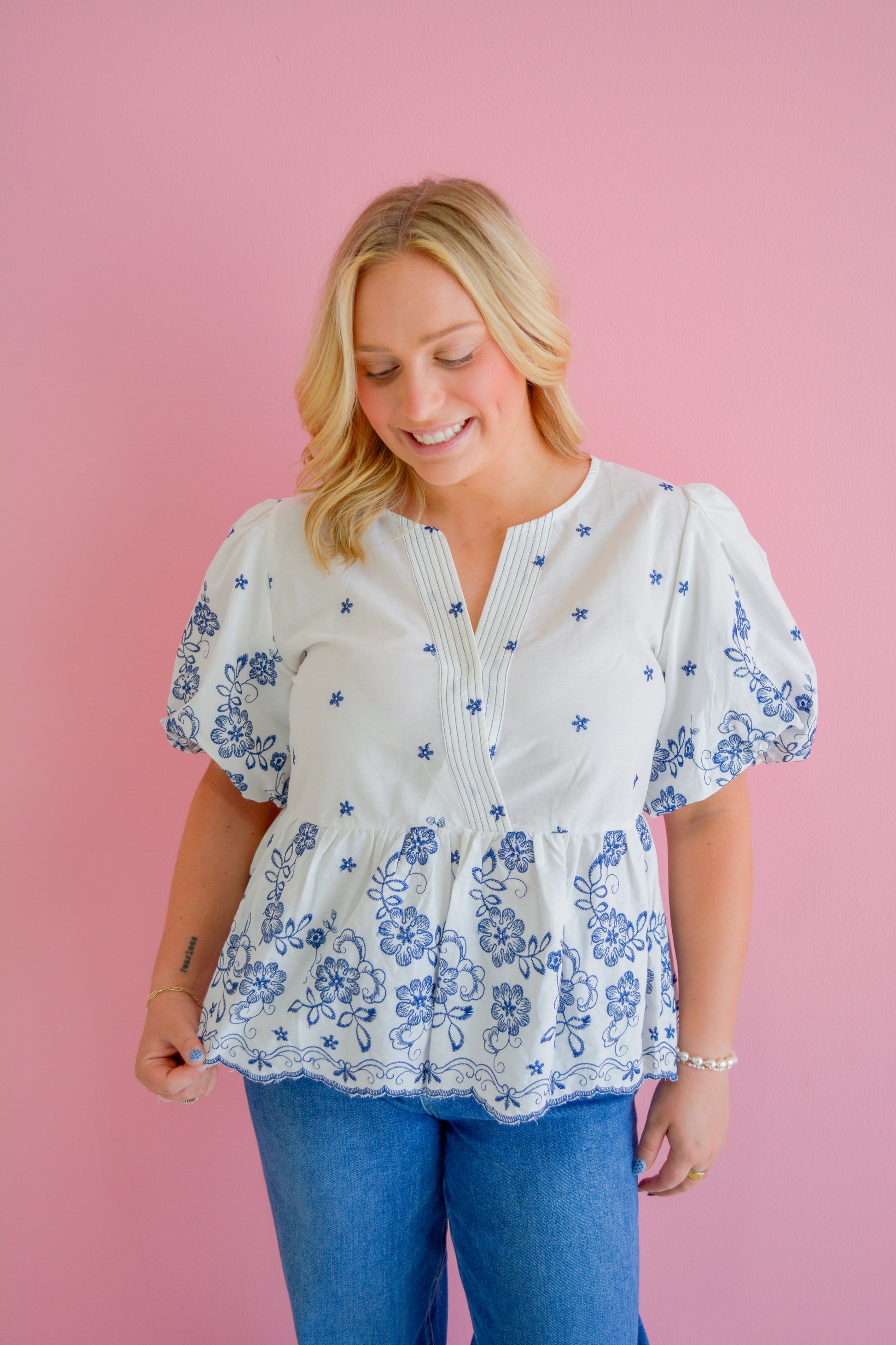 She+Sky Midnight Floral Blouse featuring a dark floral print, long sleeves, and a relaxed fit, displayed on a hanger.