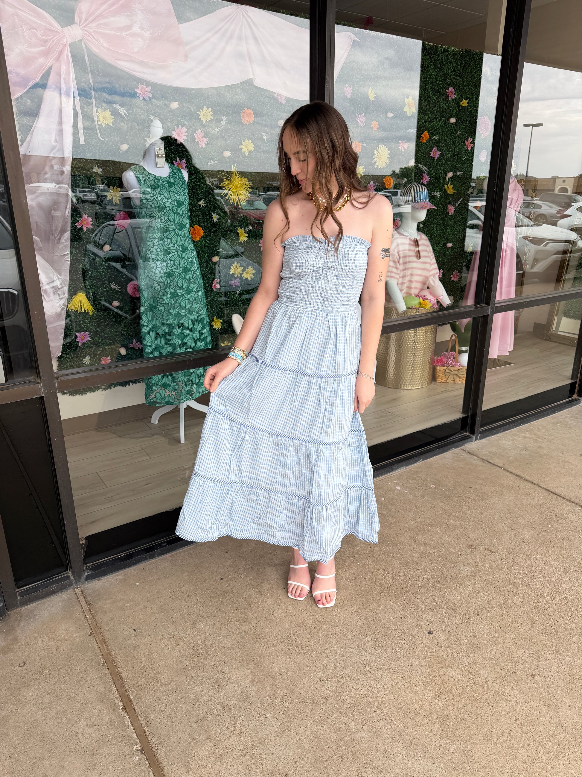 Baby Pink soft statement midi dress in baby blue, featuring a flowing silhouette and elegant design.